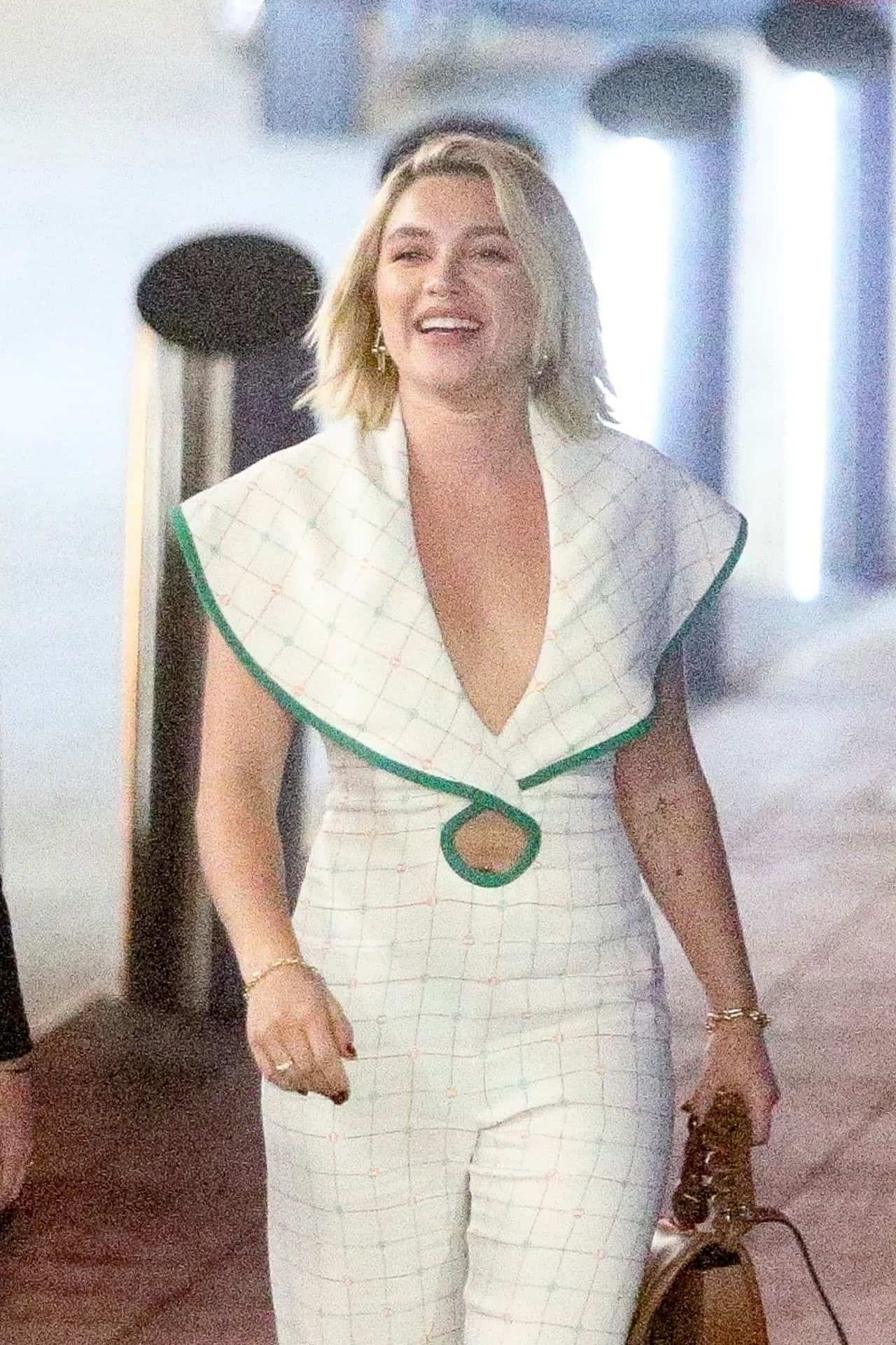 Florence Pugh in a Plunging White Jumpsuit Arrives for "The Wonder" Q&A