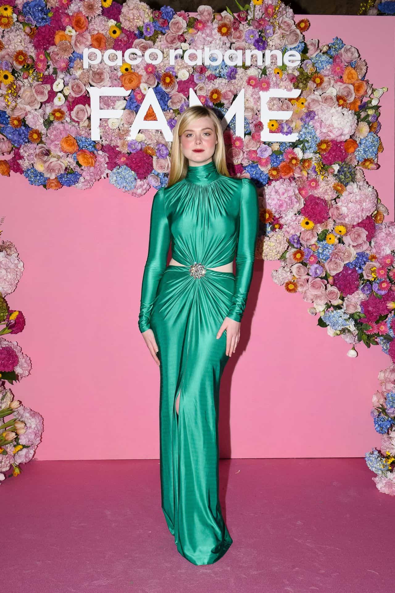 Elle Fanning Steps Out in Emerald Green Dress at Paco Rabanne “FAME” Event