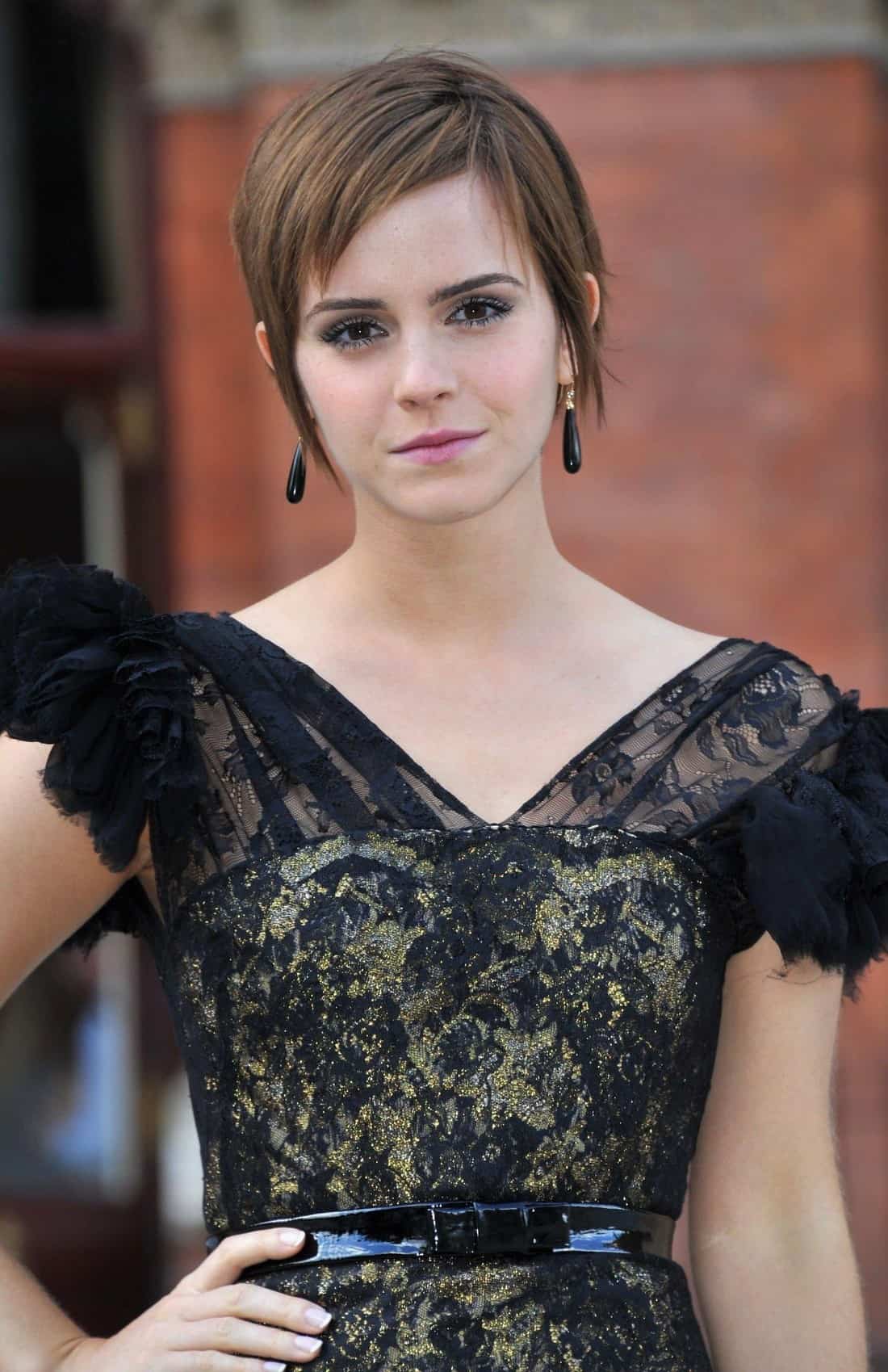 Emma Watson Radiates Beauty in Black and Gold Dress at Photocall
