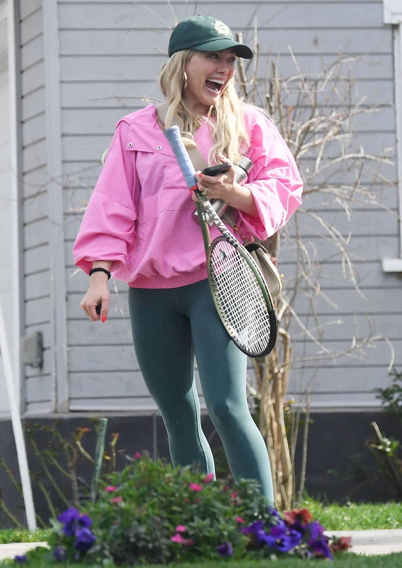 Hilary Duff in Sports Jumpsuit and Pink Windbreaker for Tennis Game