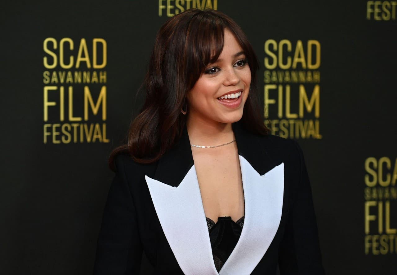 Jenna Ortega was in attendance at the 25th SCAD Savannah Film Festival. The actress made a stunning appearance on the red carpet, dressed in a monochrome RVN jumpsuit. The jumpsuit was a low-key yet impactful choice, with an oversized white collar serving as the standout feature. The collar was a nod to her upcoming role as Wednesday Addams in the Netflix series "Wednesday." This fashion choice showcased Ortega's commitment to her character and her keen sense of style. The monochrome jumpsuit provided a chic and modern twist on a classic look, making her one of the most stylish attendees of the 25th SCAD Savannah Film Festival.