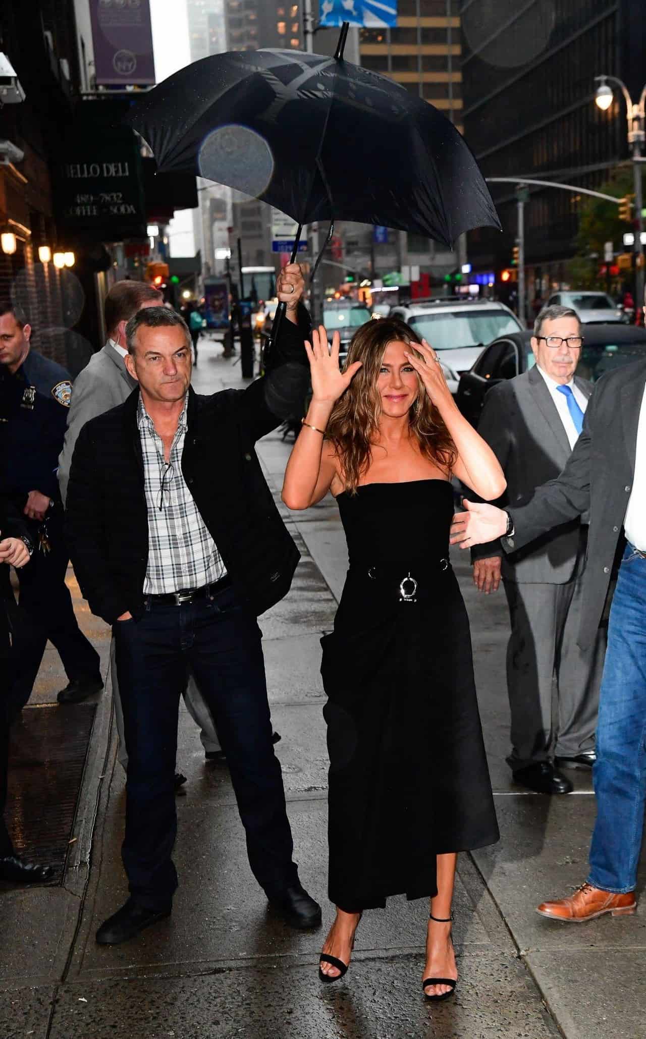 Jennifer Aniston Arrives in Prada Midi Dress at Stephen Colbert Show