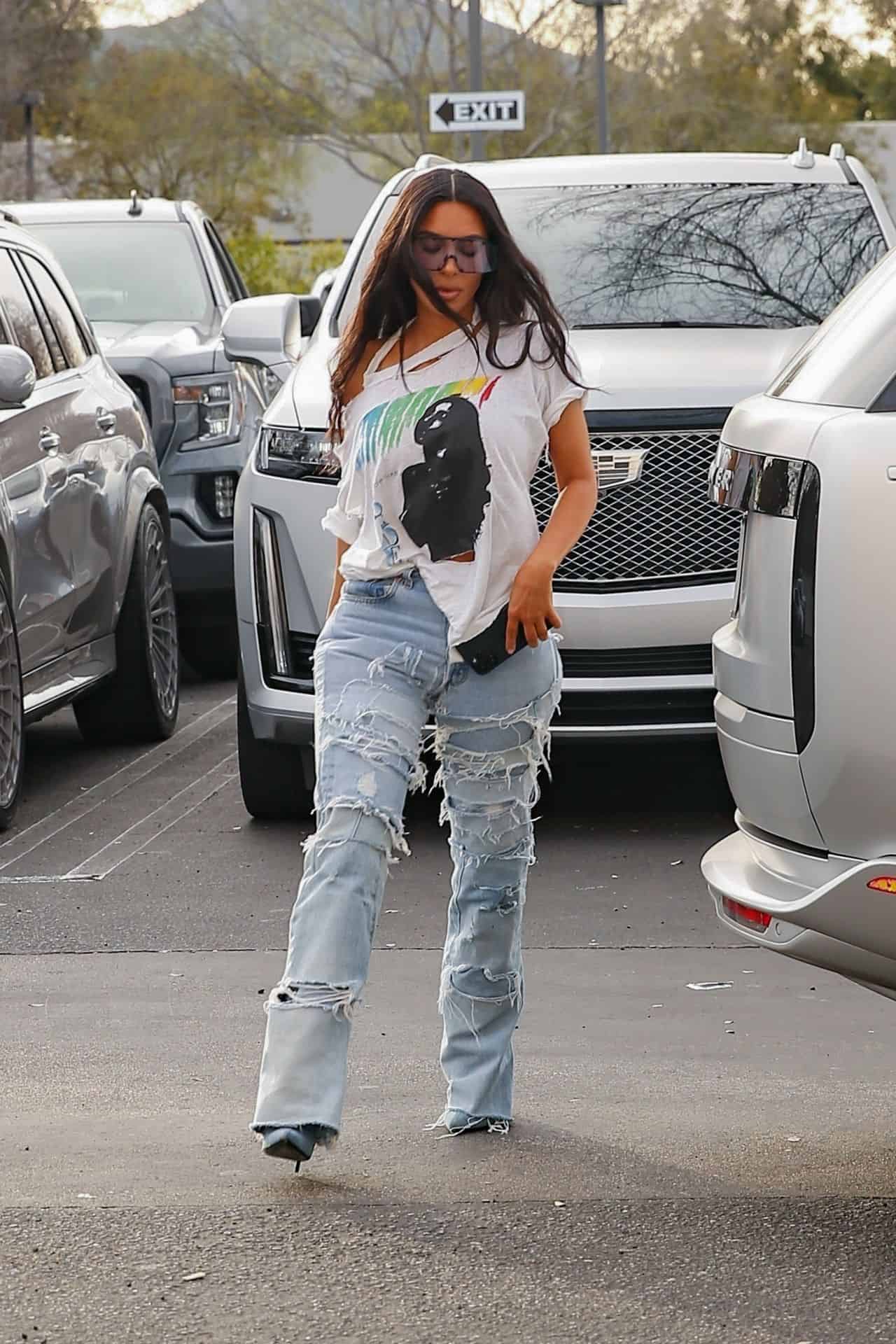 Kim Kardashian Looks Chic in a Sade T-shirt at Saint's Basketball Game
