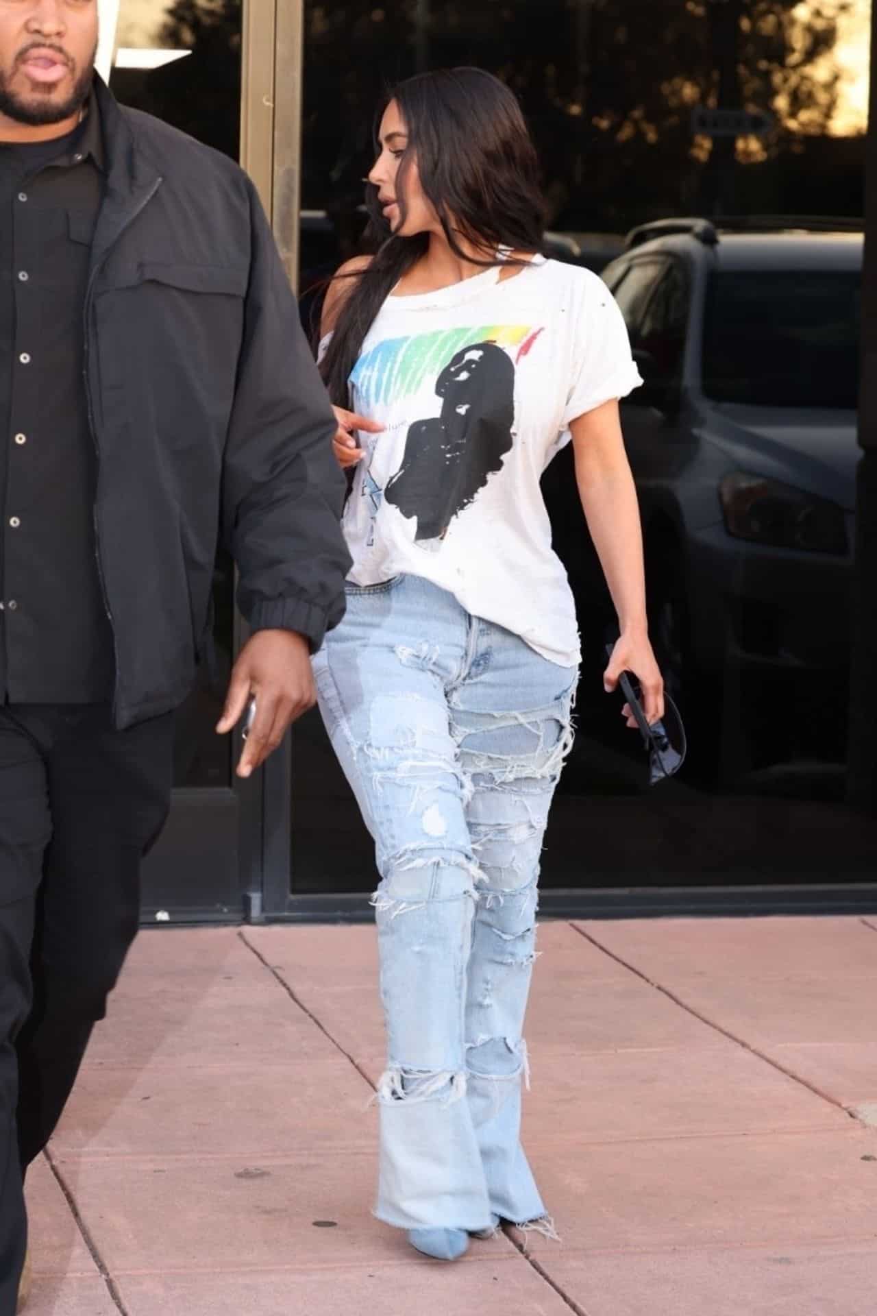 Kim Kardashian Looks Chic in a Sade T-shirt at Saint's Basketball Game