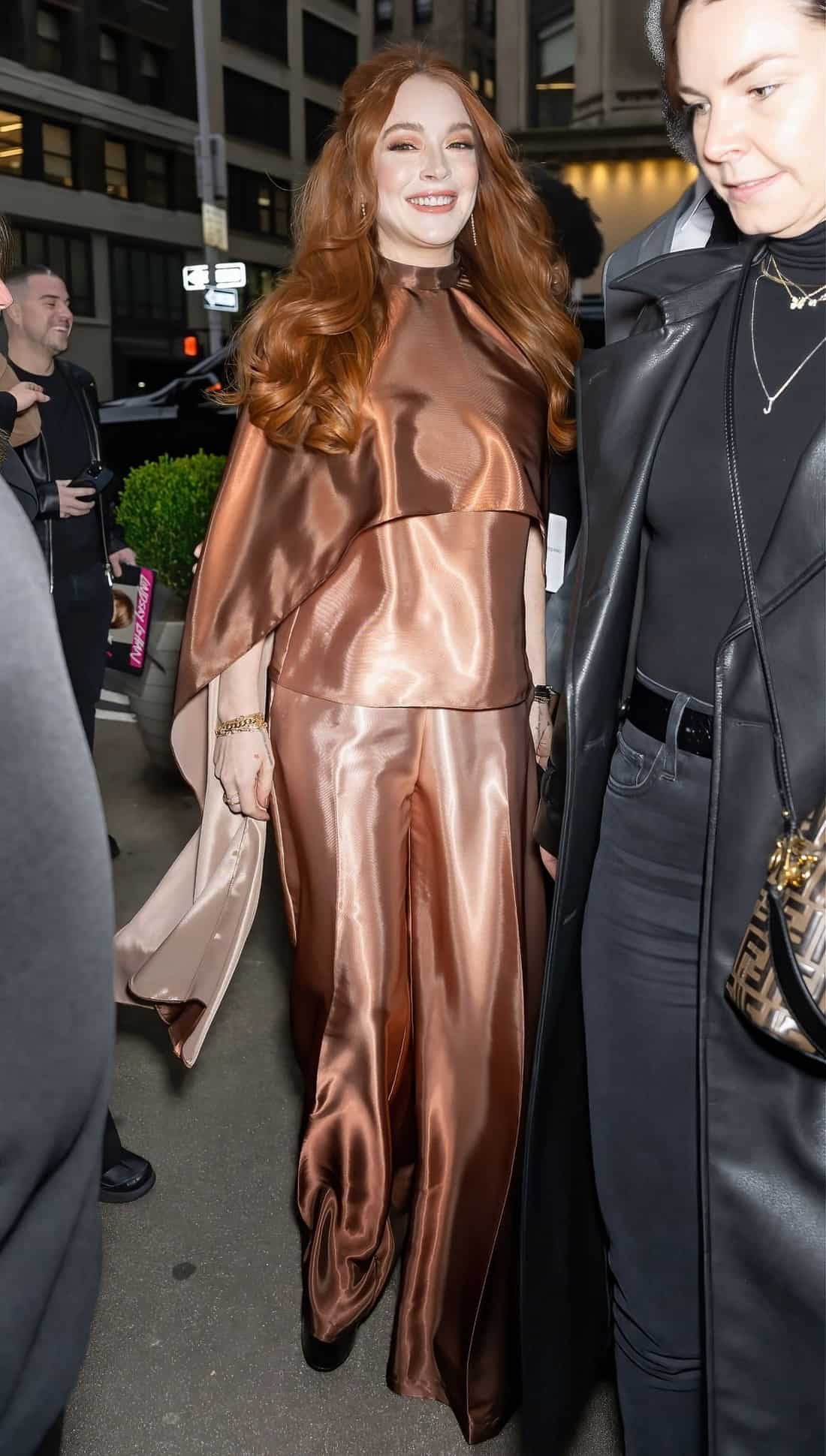 Lindsay Lohan Shines at 2023 NYFW in a Rust-Toned Outfit by Siriano