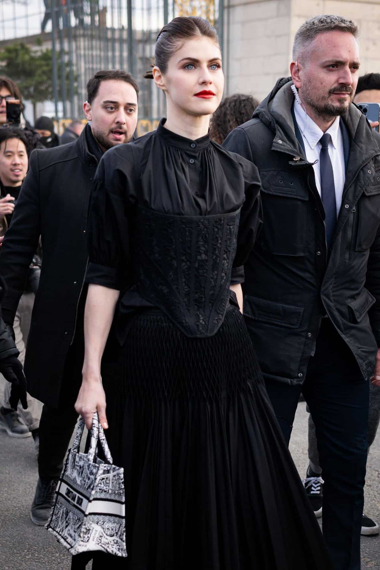 Alexandra Daddario in Gothic Dress Attends Dior’s Fall 2023 Show at PFW