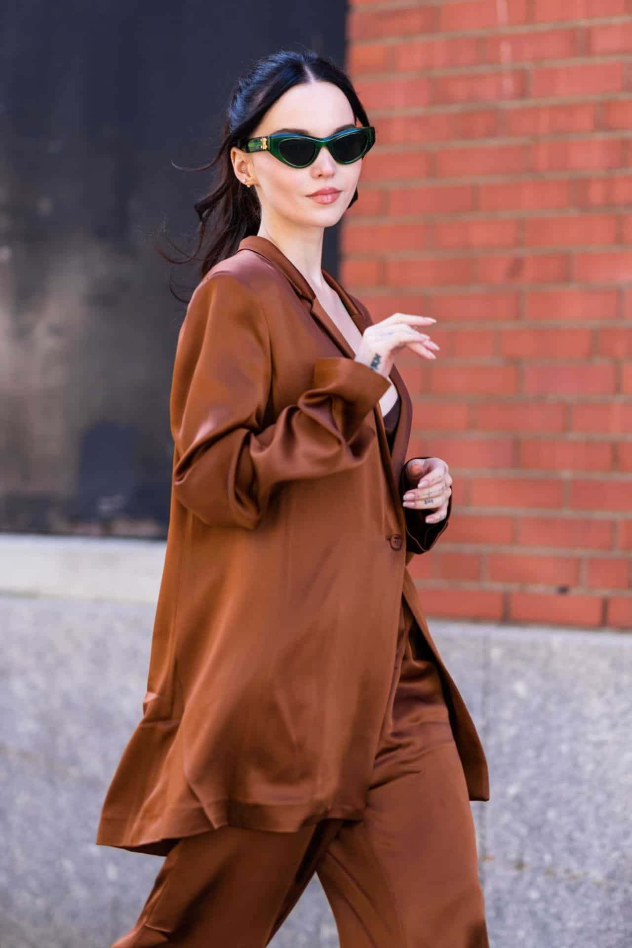 Dove Cameron Nails the Chic Look in Bronze Pantsuit in New York City