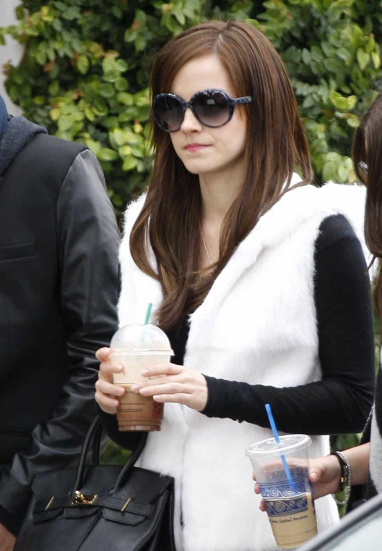 Emma Watson Nails Hollywood Style in a White Fur Vest and Tight Jeans