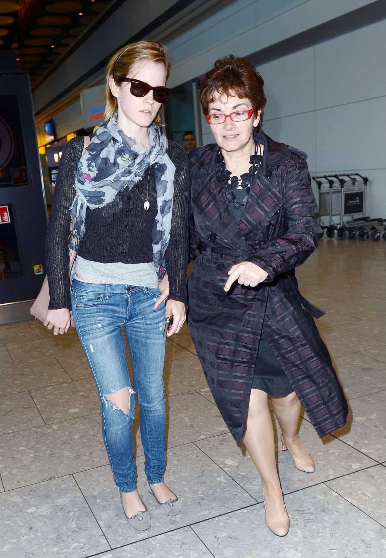 Emma Watson Nails the Chic Travel Look in a Black Sweater and Skinny Jeans