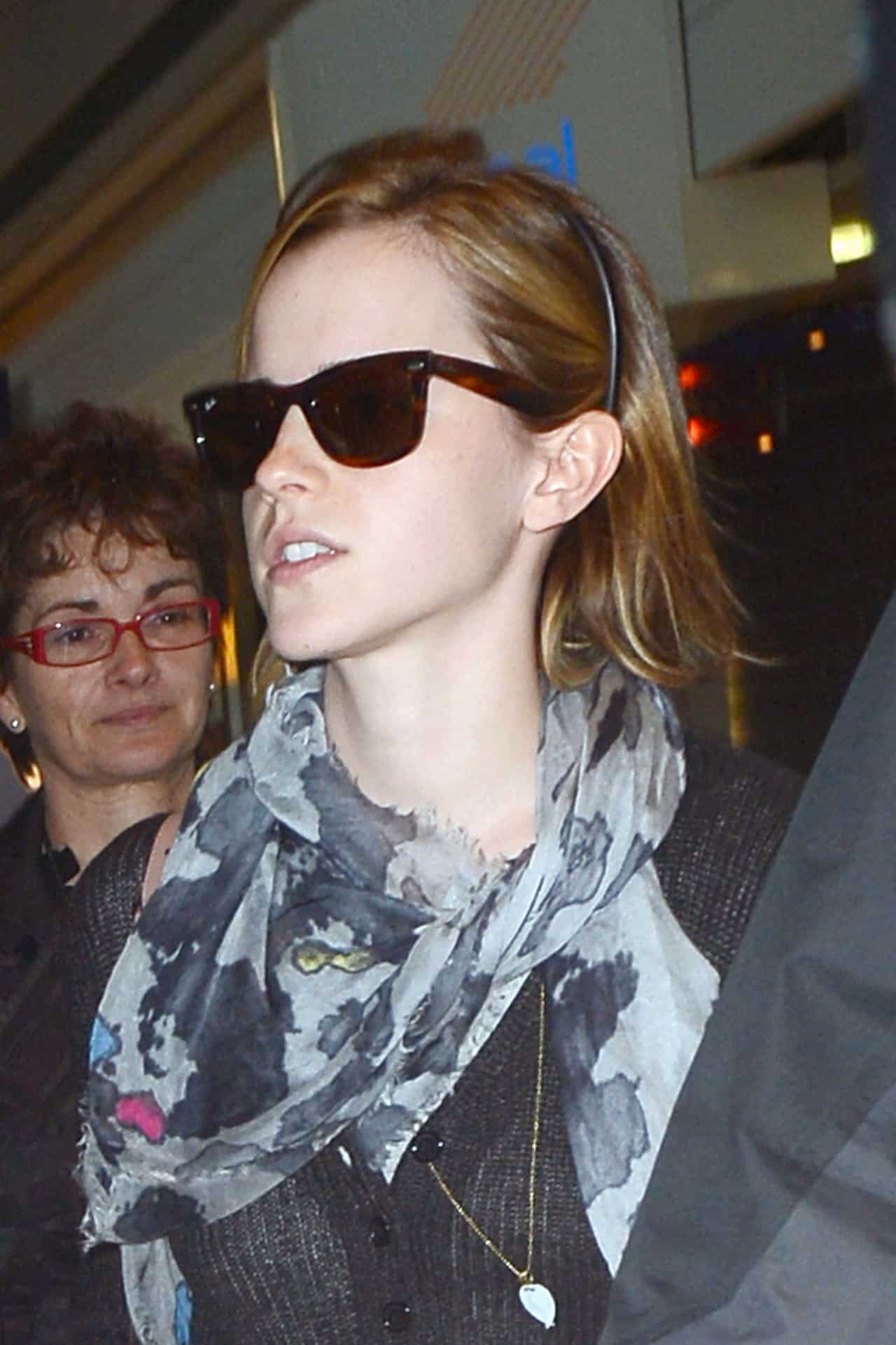 Emma Watson Nails the Chic Travel Look in a Black Sweater and Skinny Jeans