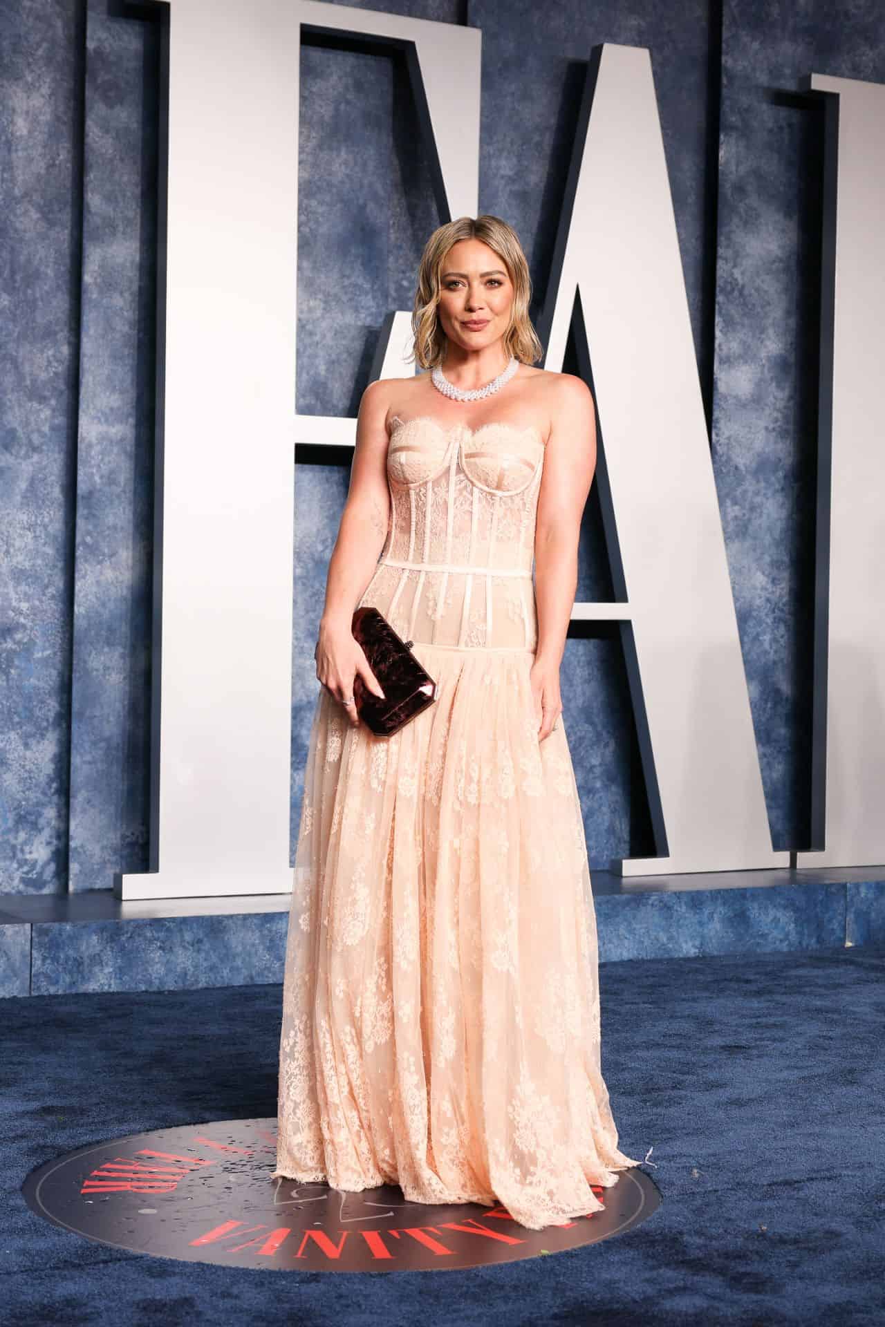 Hilary Duff Stuns in a Peach Gown at the 2023 Vanity Fair Oscars Party