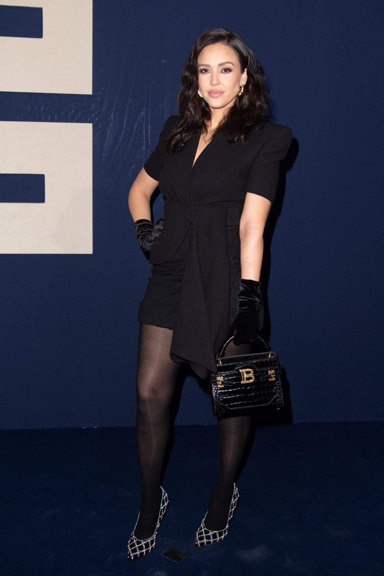 Jessica Alba in a Short-Sleeved Black Dress at Balmain’s PFW Show