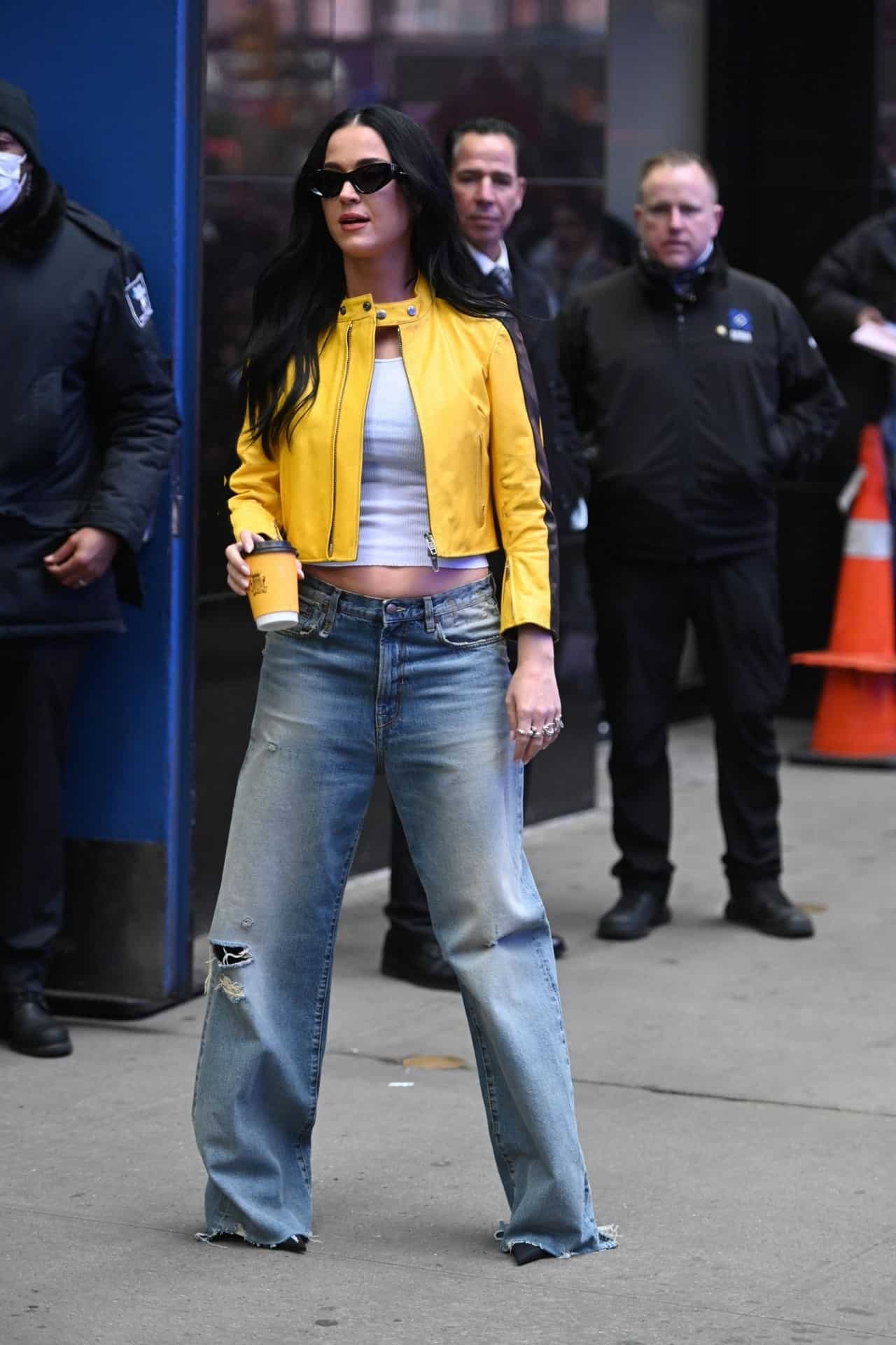 Katy Perry in Cropped Yellow Leather Jacket and Baggy Jeans in NYC