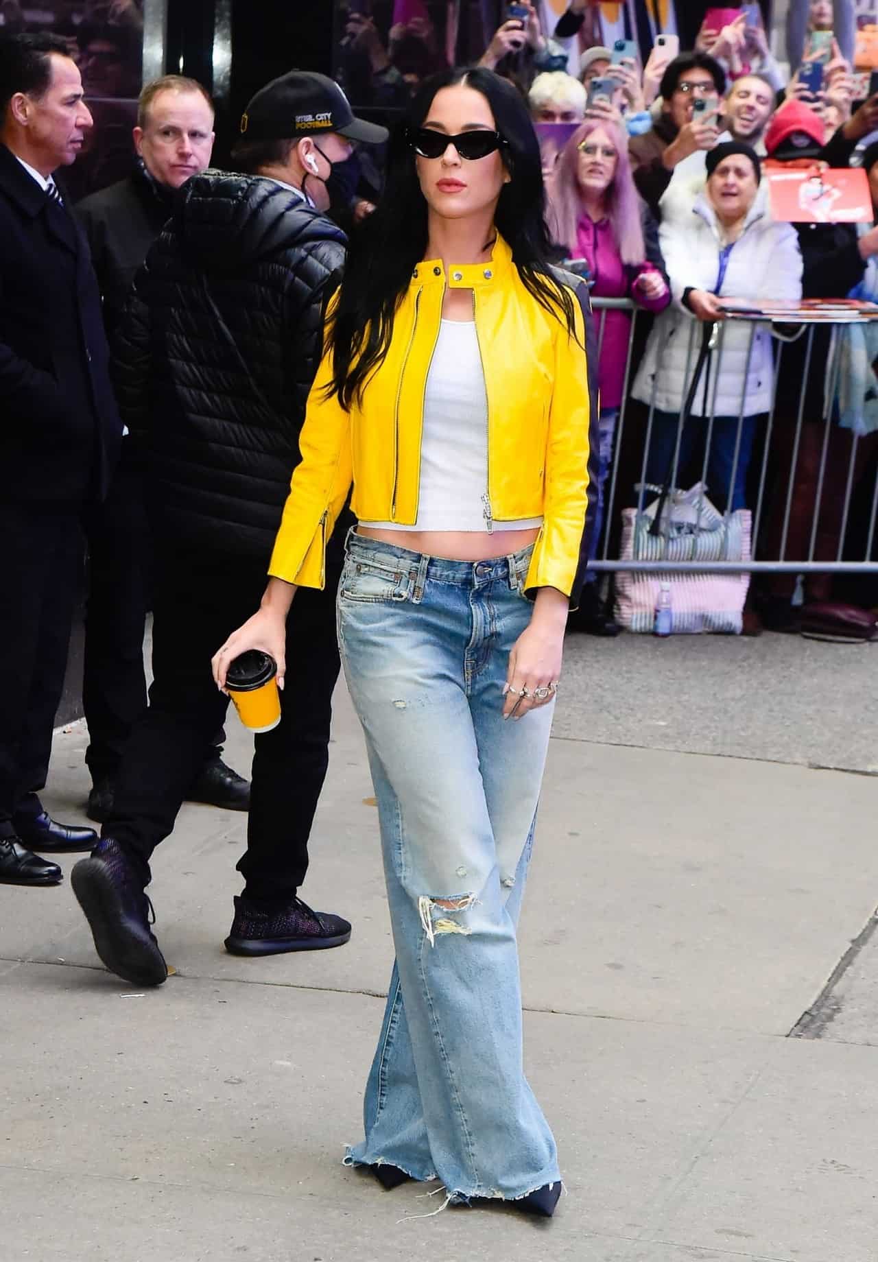 Katy Perry in Cropped Yellow Leather Jacket and Baggy Jeans in NYC