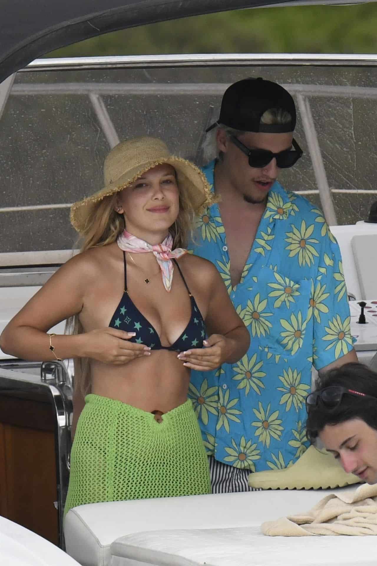 Millie Bobby Brown in a Bikini Top with Stars on a Luxury Yacht in Italy
