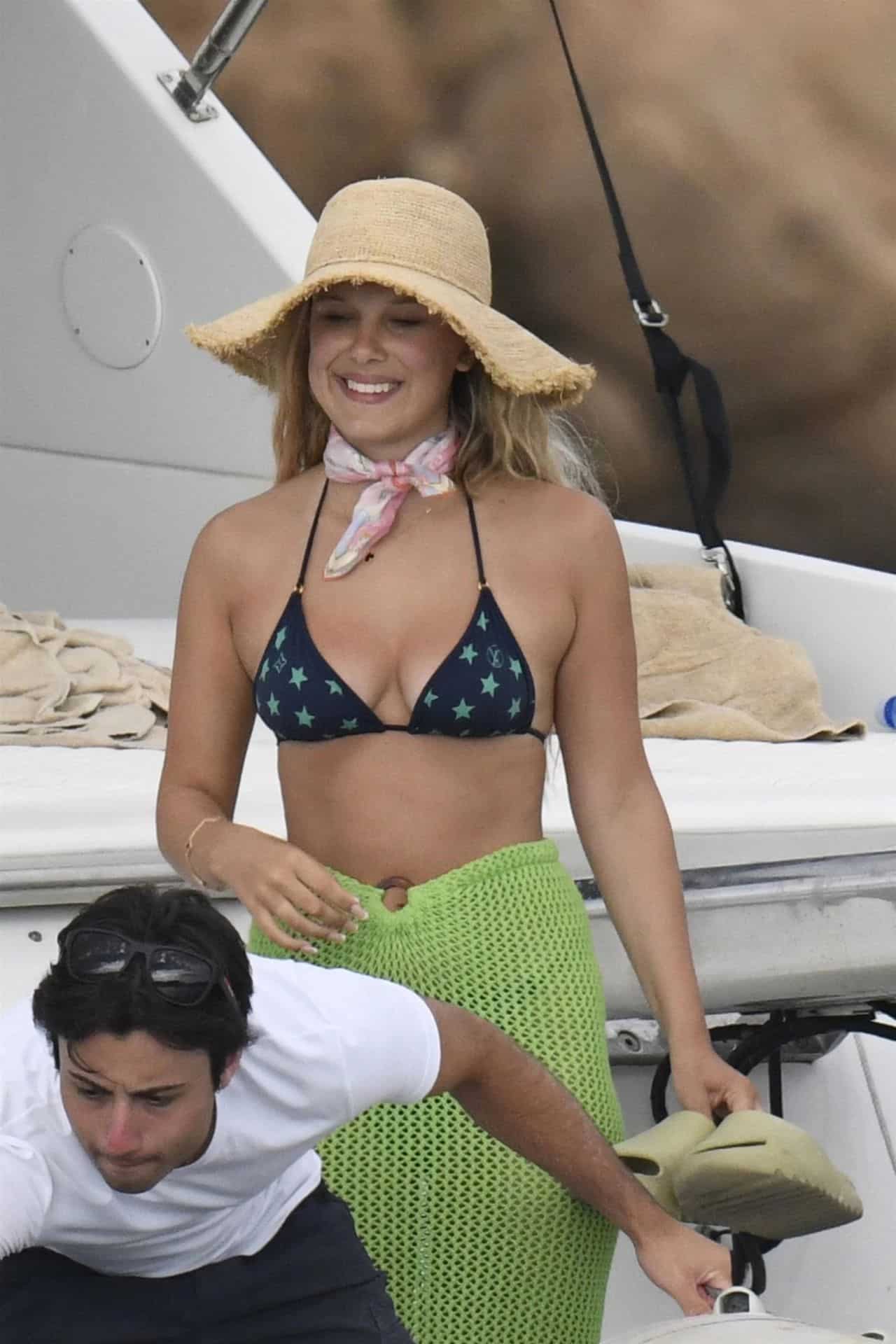 Millie Bobby Brown in a Bikini Top with Stars on a Luxury Yacht in Italy