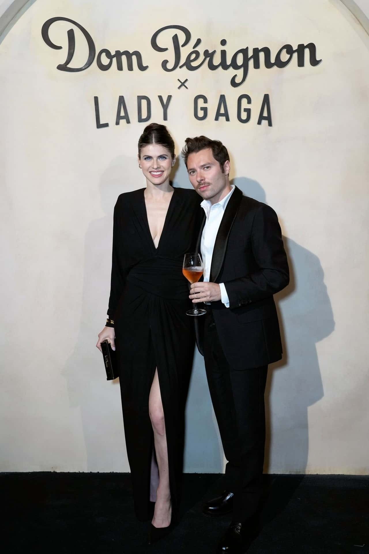 Alexandra Daddario in Black Ruched Dress at Lady Gaga's Dom Perignon Party