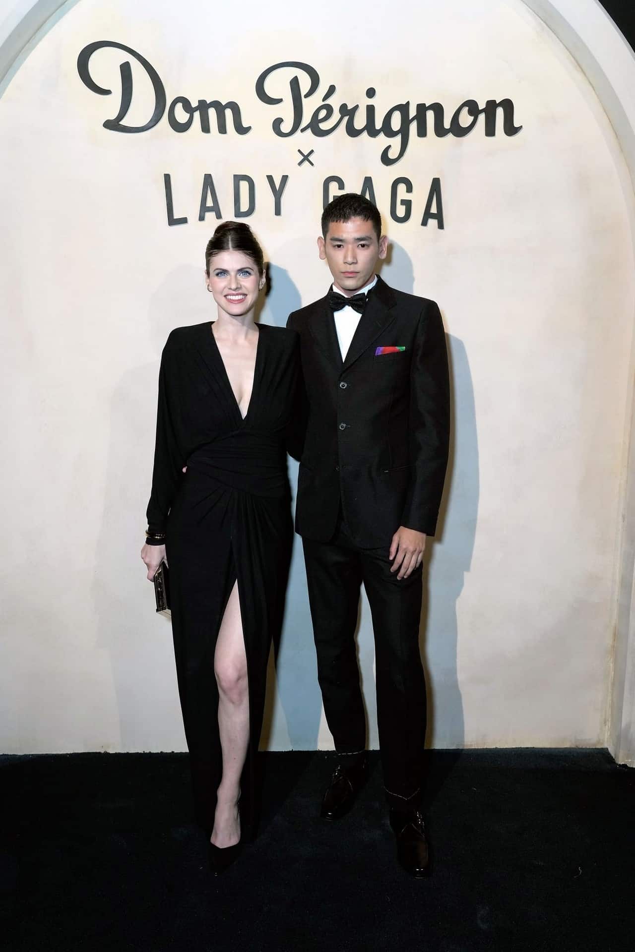 Alexandra Daddario in Black Ruched Dress at Lady Gaga's Dom Perignon Party