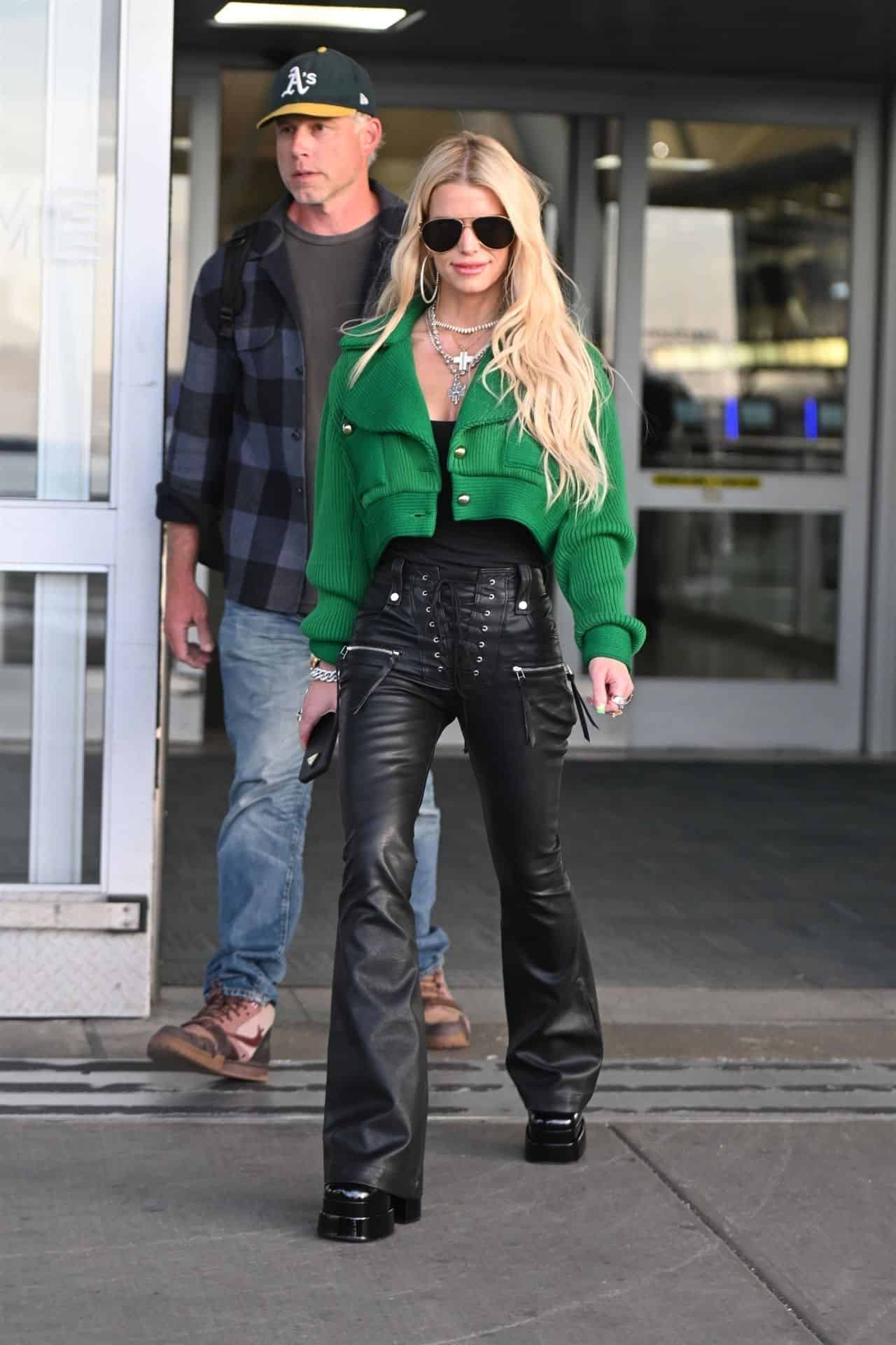 Jessica Simpson Shows Off Svelte Frame in Stylish Ensemble at JFK Airport