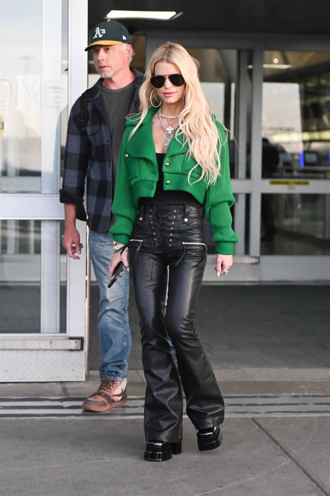 Jessica Simpson Shows Off Svelte Frame in Stylish Ensemble at JFK Airport