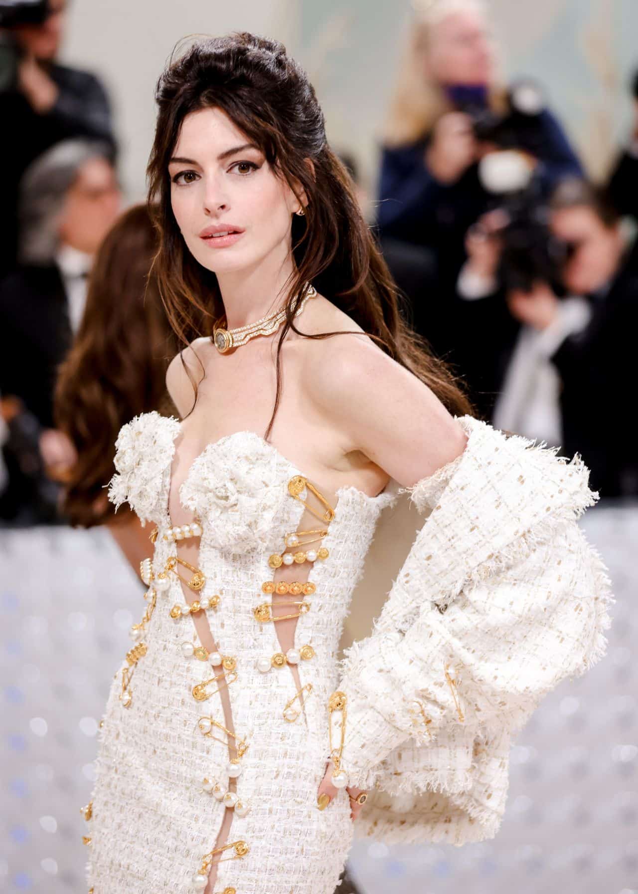 Anne Hathaway Attends the Met Gala 2023 in a White Tweed Versace Gown