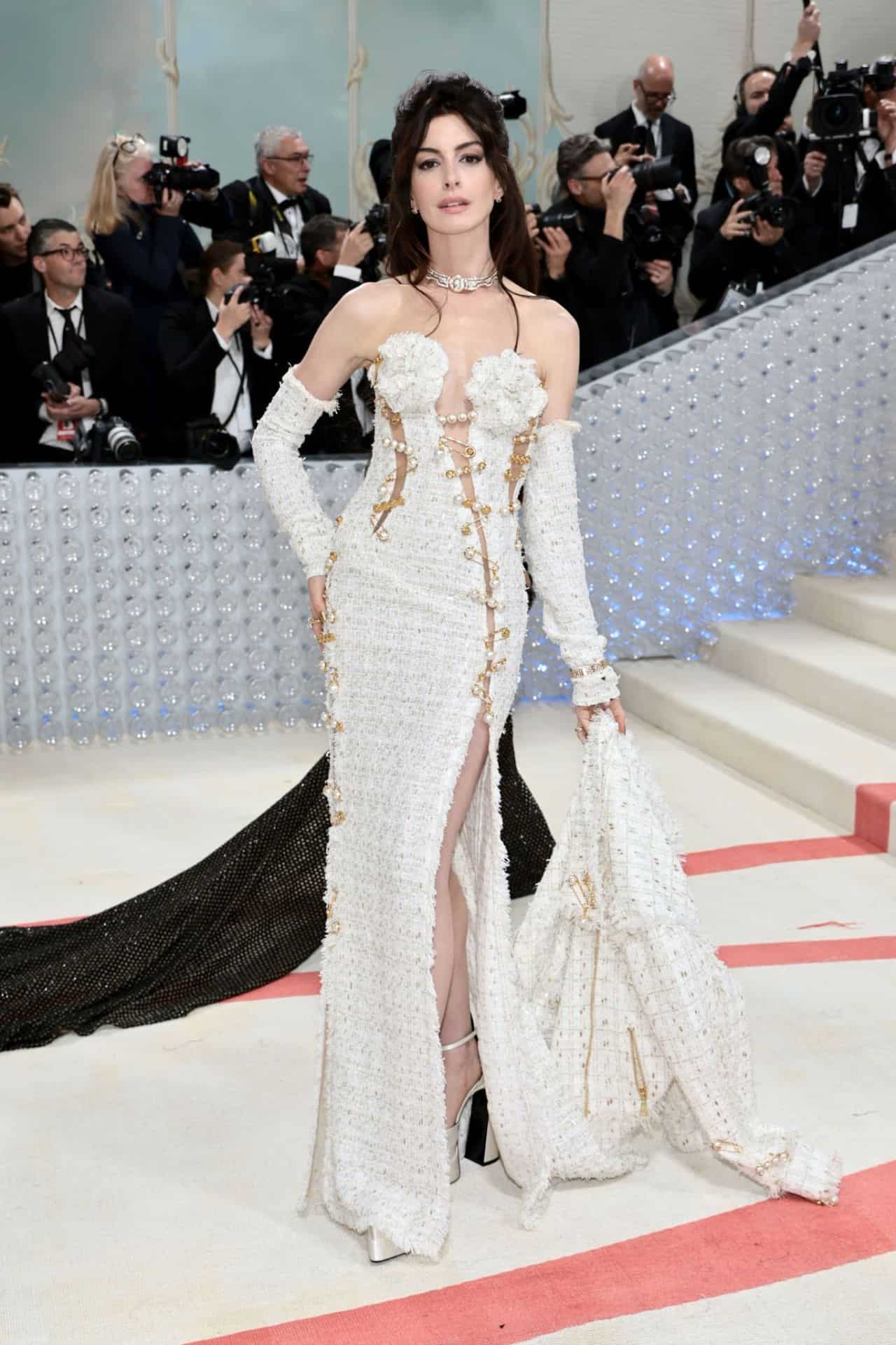 Anne Hathaway Attends the Met Gala 2023 in a White Tweed Versace Gown