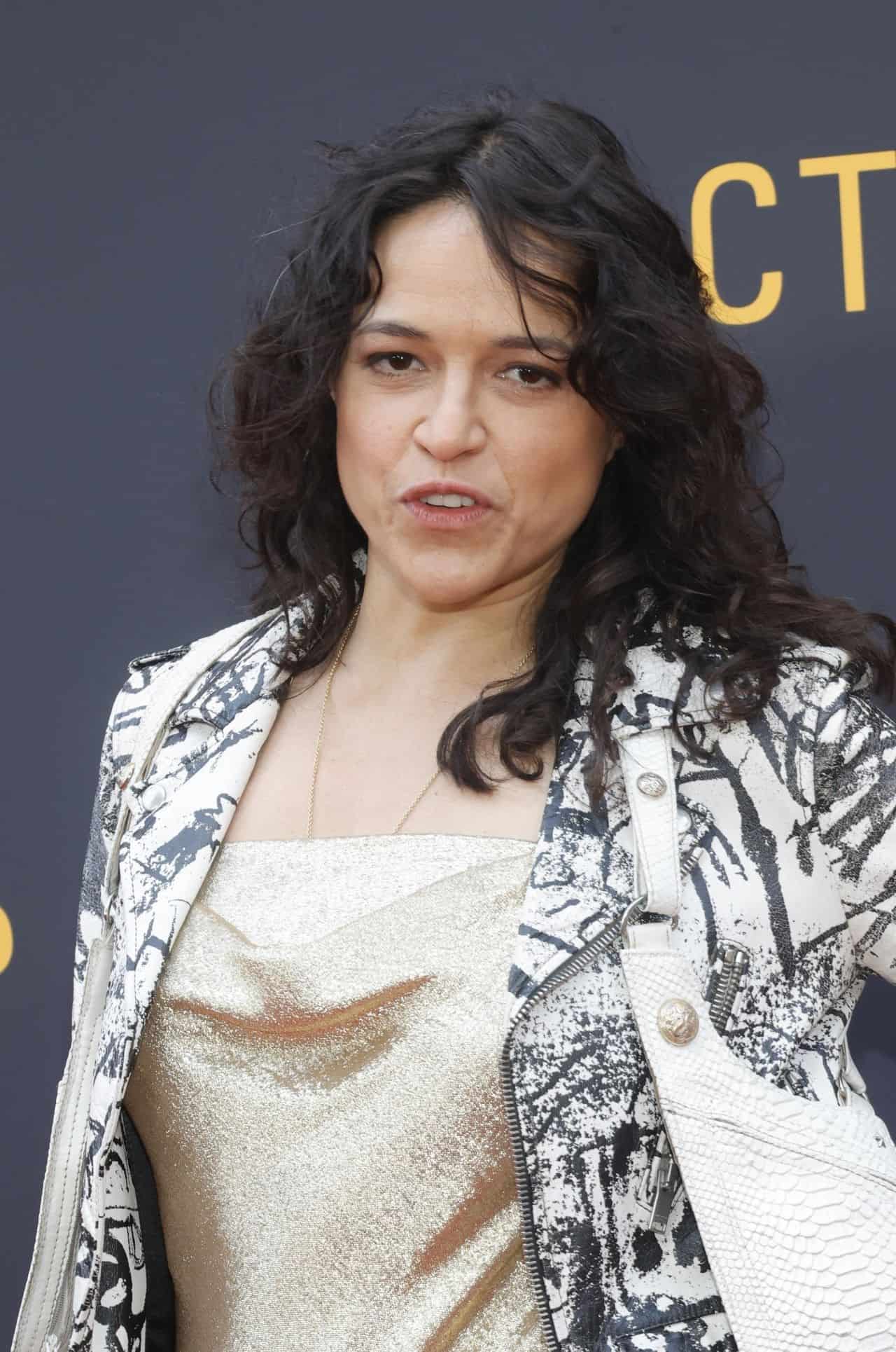 Michelle Rodriguez Rocks the Red Carpet in a Gold Dress and Leather Jacket