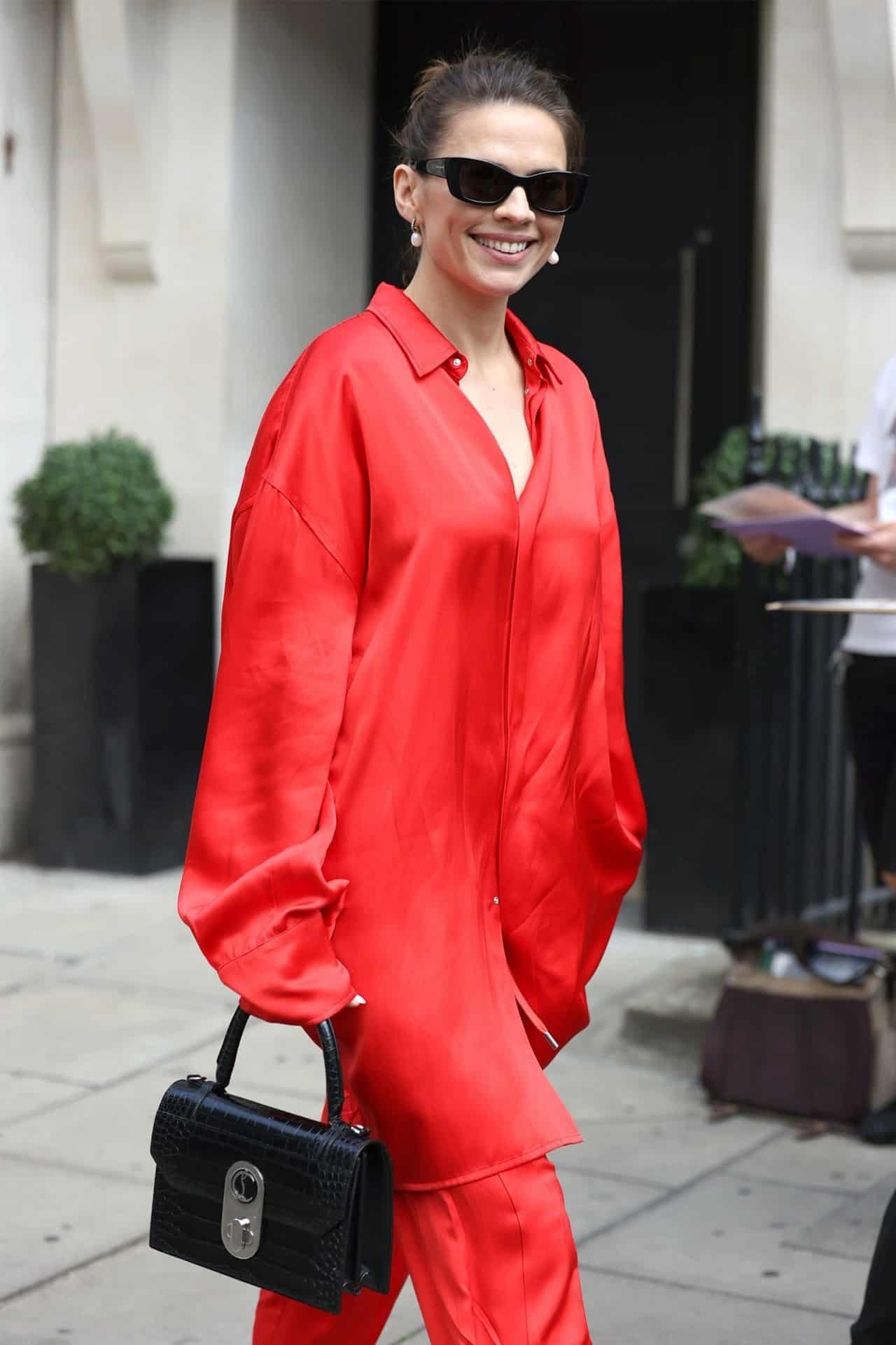 Hayley Atwell Radiates Confidence and Style in Red Silk Suit