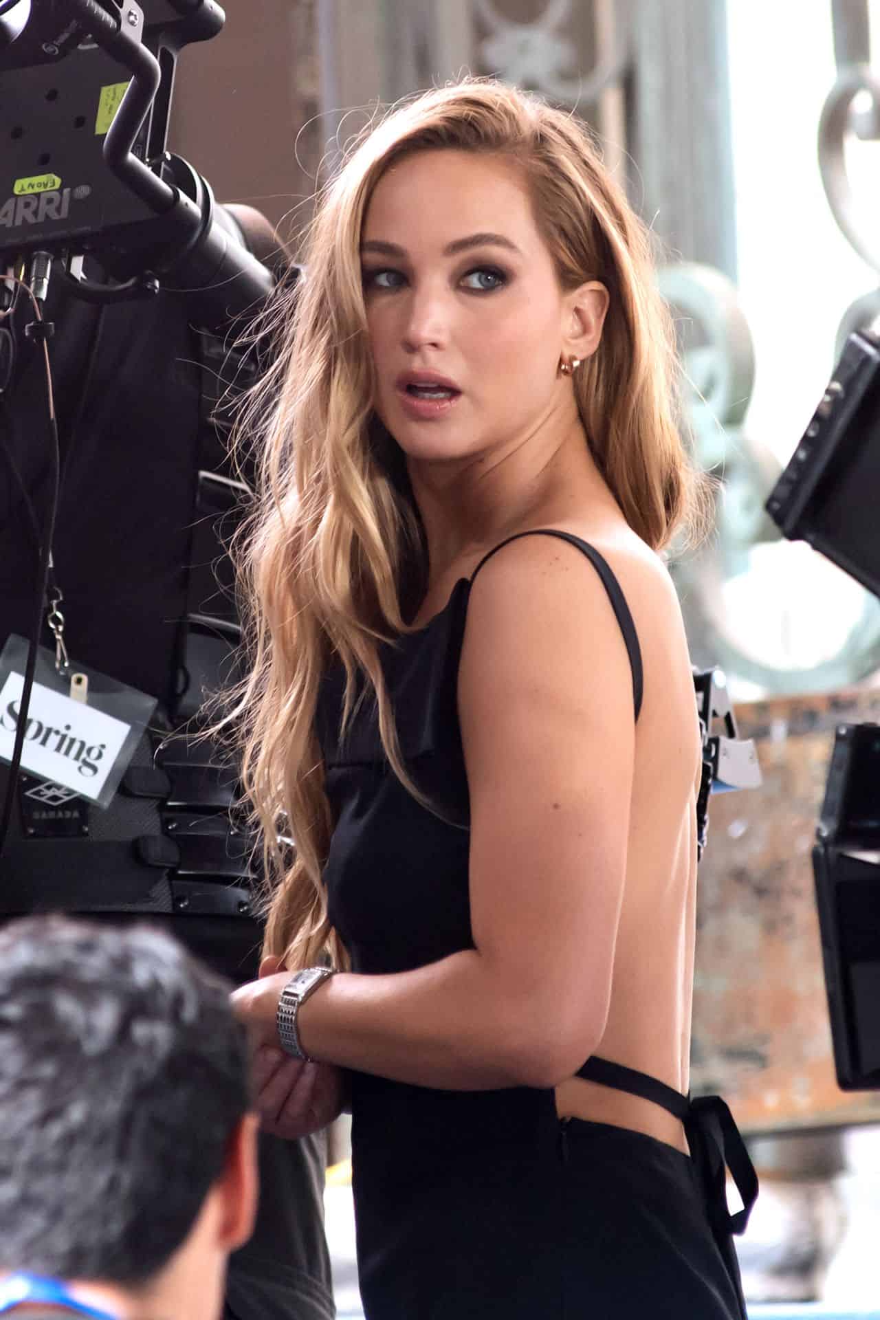 Jennifer Lawrence Stuns in Black Silk Dress in Dior Commercial Shoot in NYC