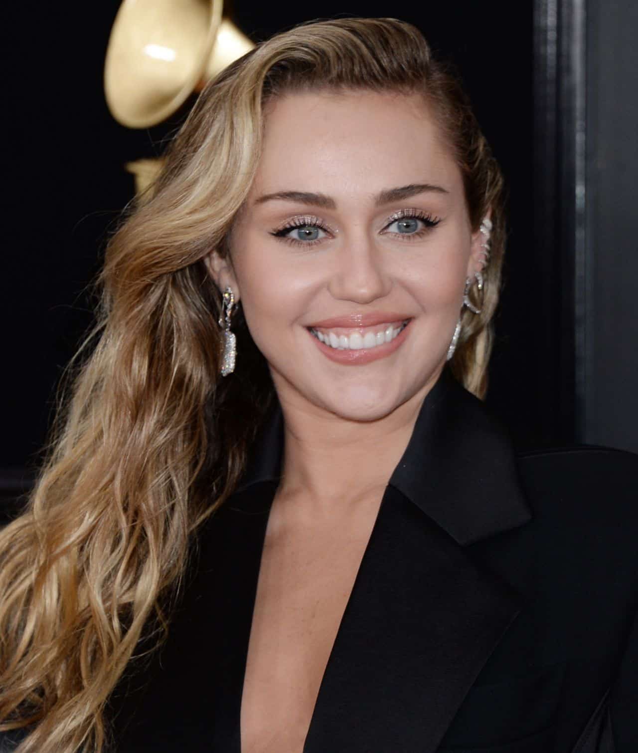 Miley Cyrus Turns Heads at the Grammy Awards with Her Chic Low-Cut Blazer