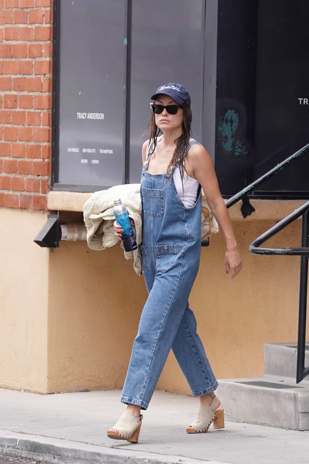 Olivia Wilde Rocks a Relaxed Look with Denim Overalls and High Clogs