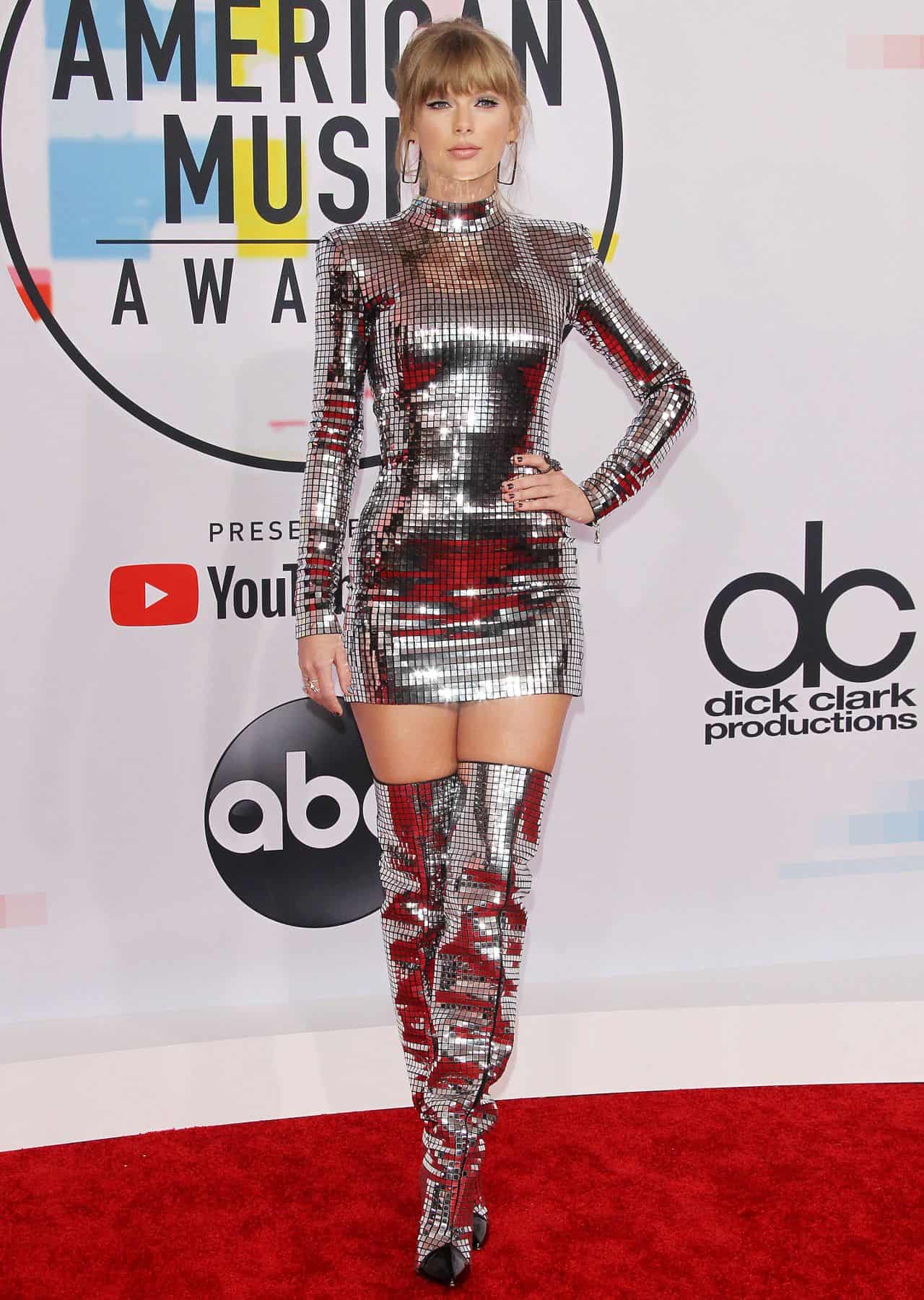 Taylor Swift Shines in Silver Mini Dress and Thigh-High Boots at AMAs