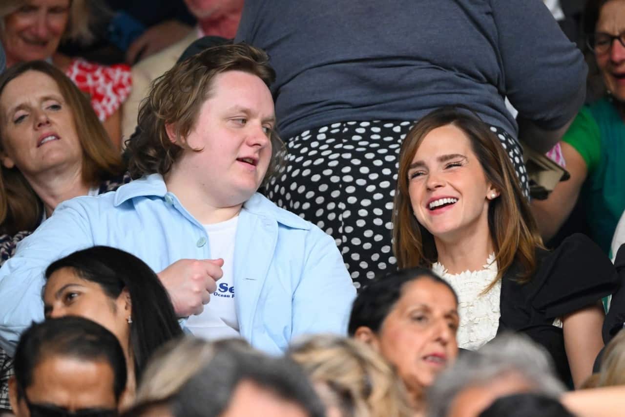 Emma Watson Stuns in a White Lace Mini Dress at Wimbledon with Her Father