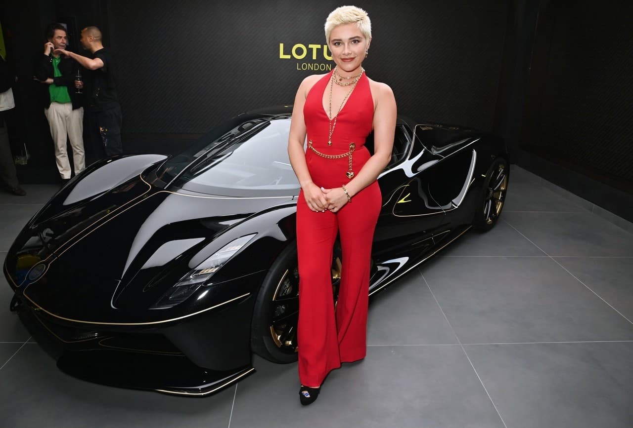 Florence Pugh Stuns in Fiery Red Jumpsuit at Lotus London Flagship Opening
