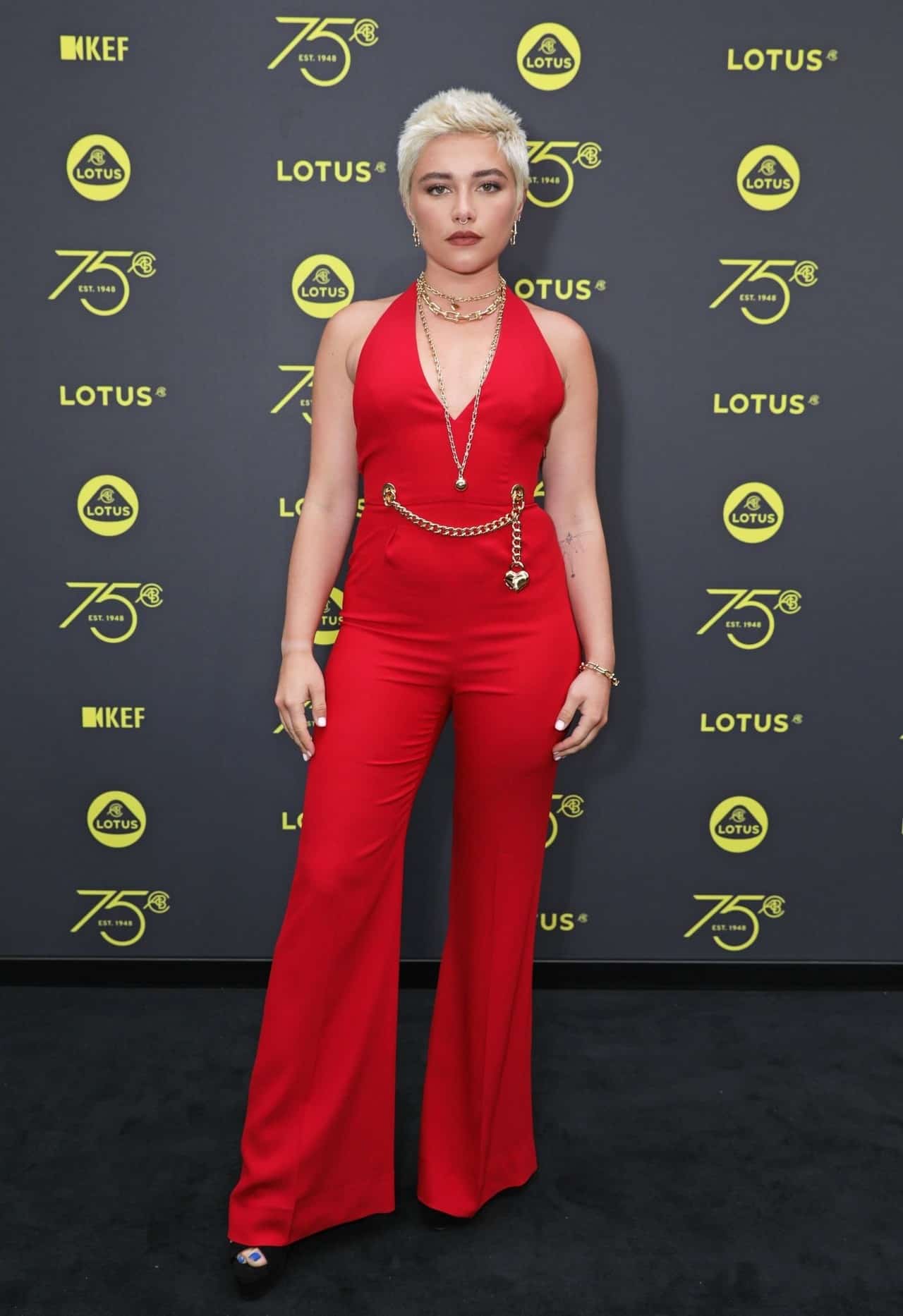 Florence Pugh Stuns in Fiery Red Jumpsuit at Lotus London Flagship Opening