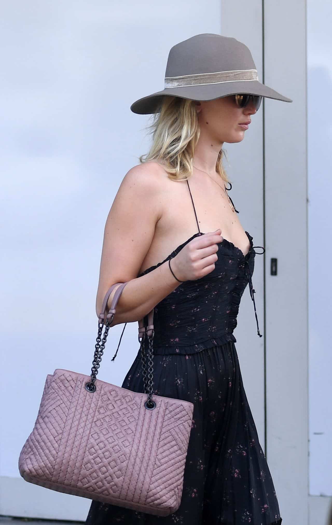 Jennifer Lawrence Goes for Edgy Airport Style in Dress and Combat Boots