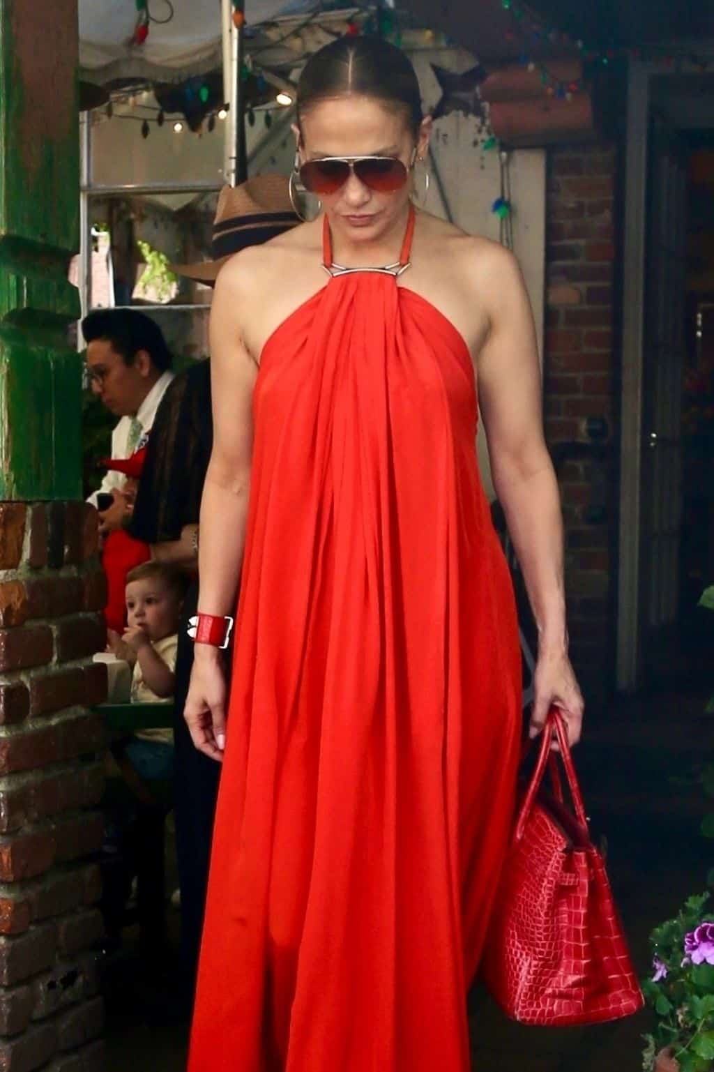 Jennifer Lopez Sets the Temperature Soaring in Red-Hot Halter Maxi Dress