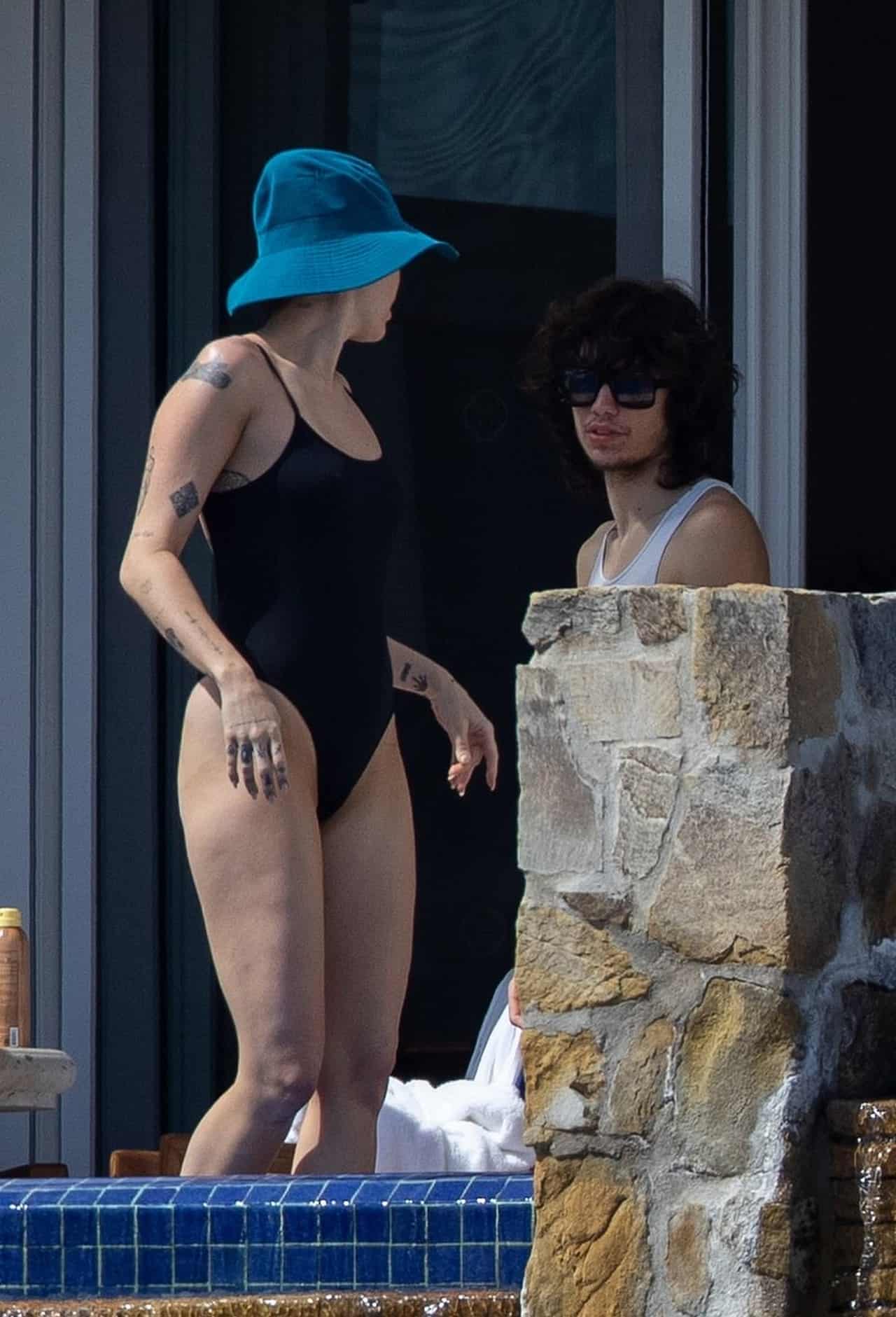 Miley Cyrus Shows Off Toned Legs in Black One-Piece in Cabo San Lucas