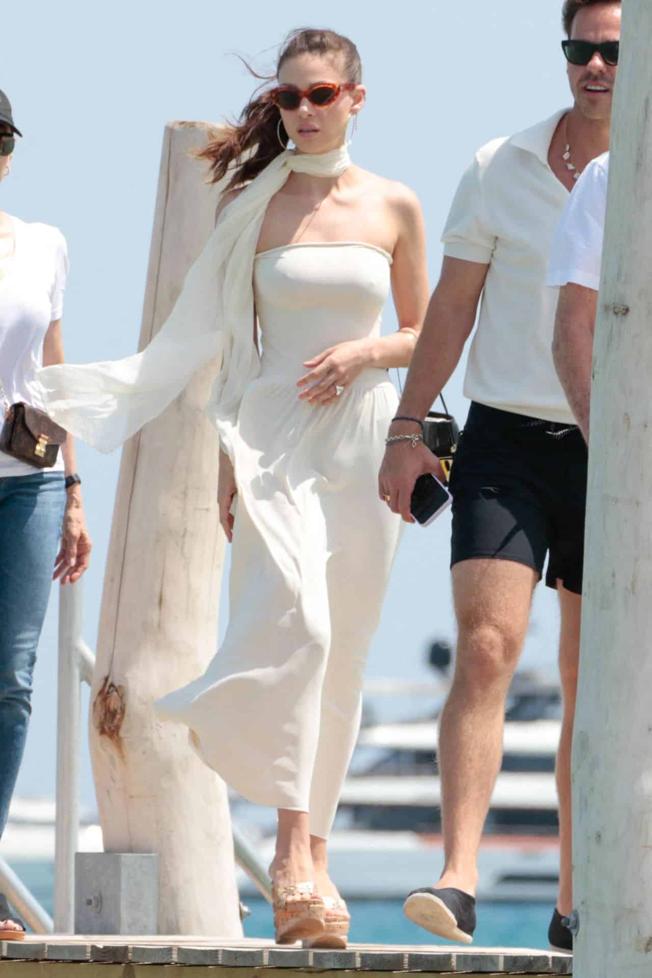 Nicola Peltz Looks Sensational in White Strapless Dress at Club 55