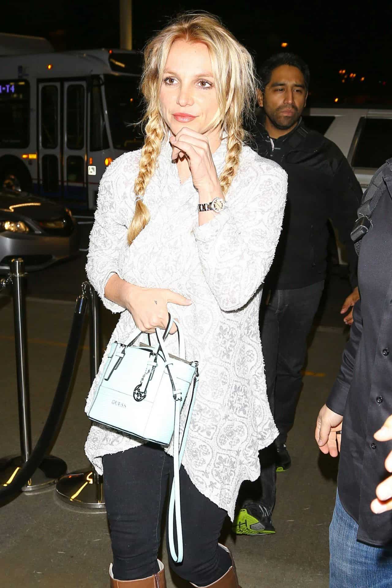 Britney Spears Looks Effortlessly Chic in White Lace Top and Jeans at LAX