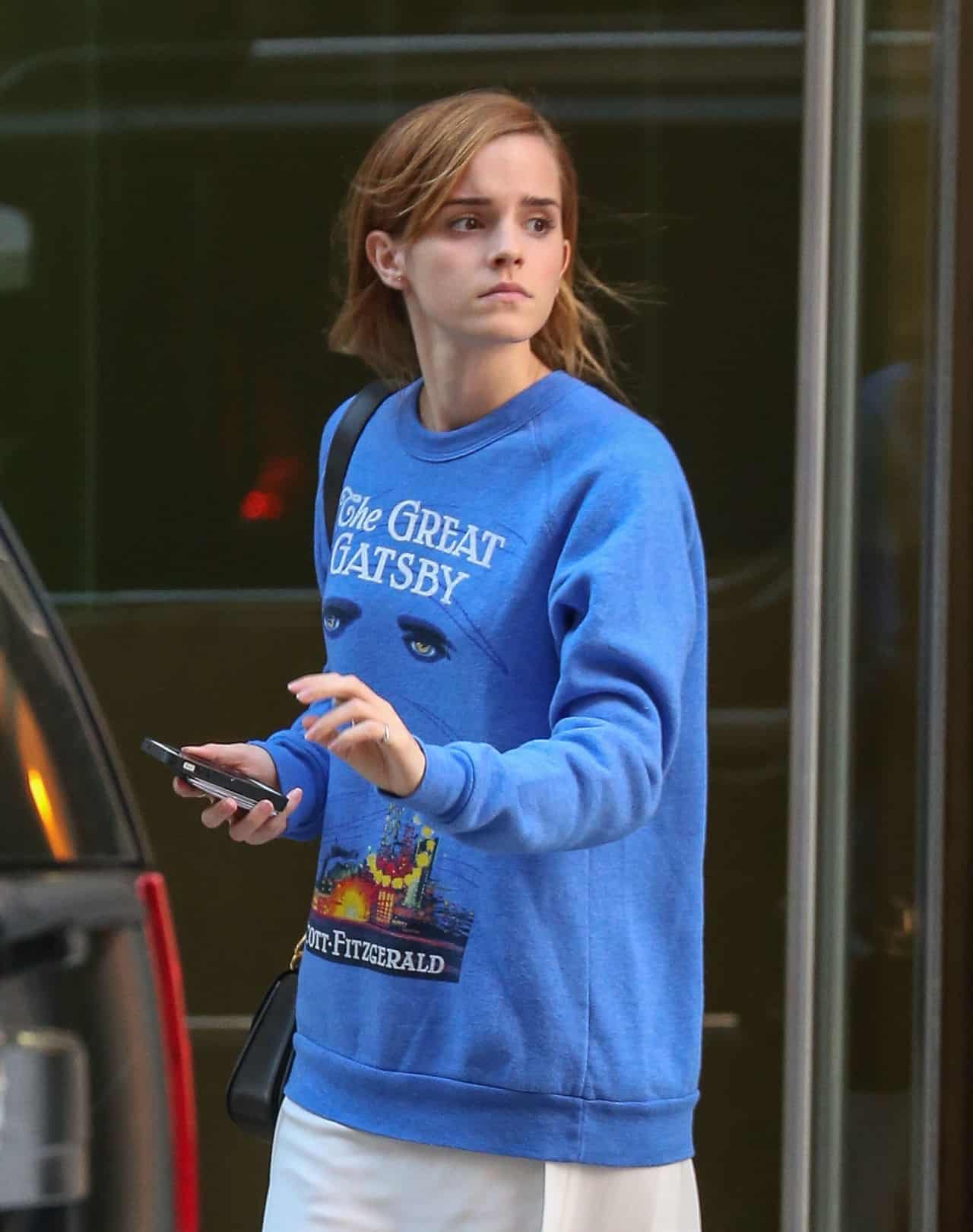 Emma Watson Stuns in Cream Dress and Vibrant Blue Sweater in New York City