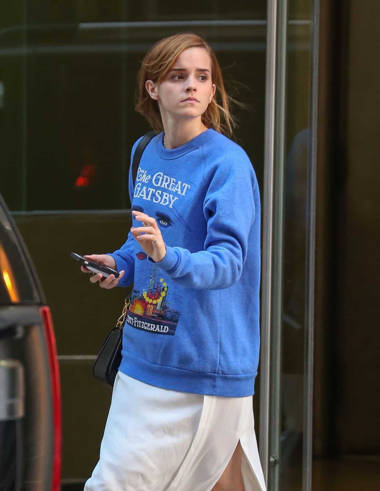 Emma Watson Stuns in Cream Dress and Vibrant Blue Sweater in New York City