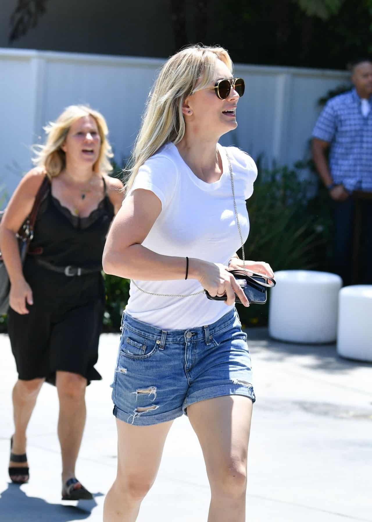 Kaley Cuoco Shows Off Toned Legs in White T-Shirt and Denim Shorts