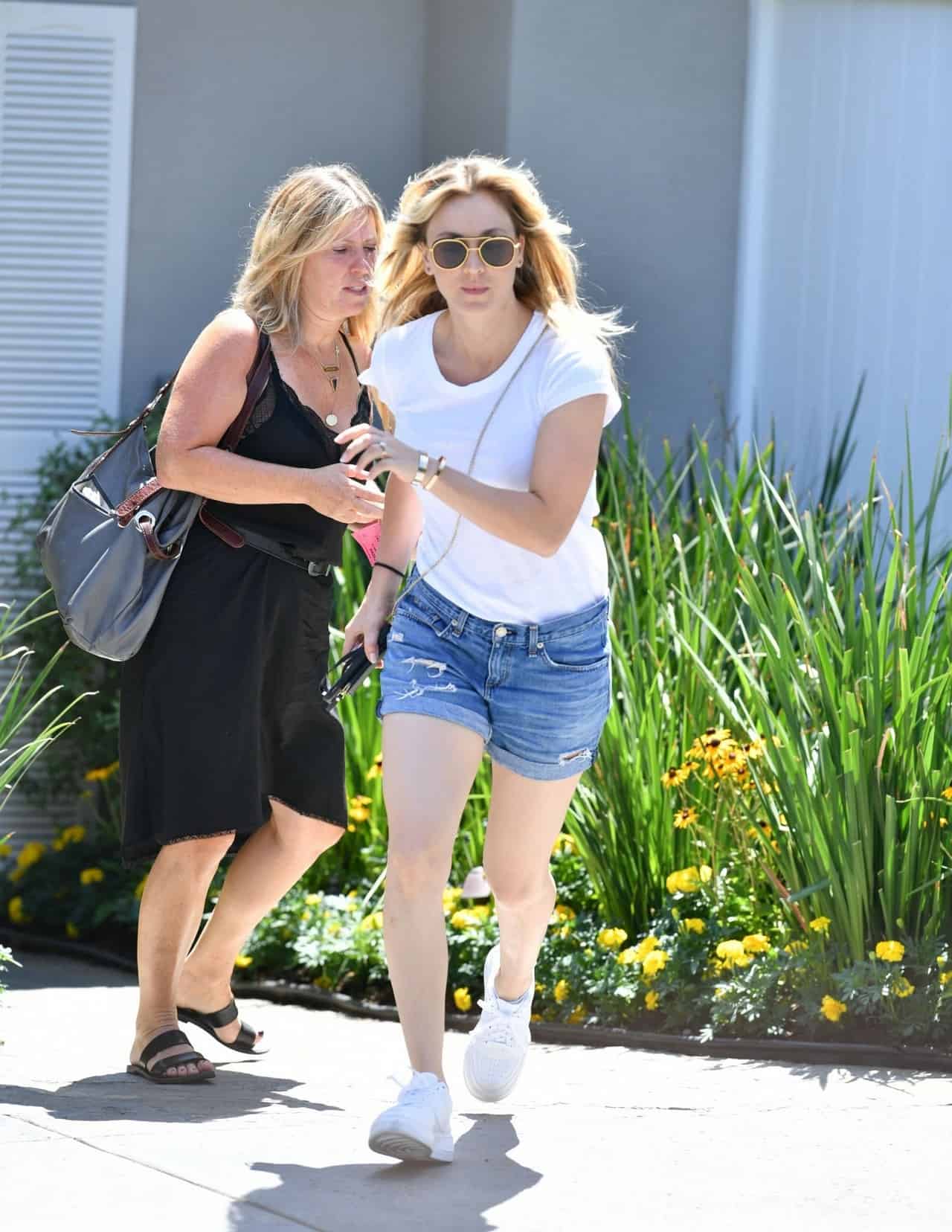 Kaley Cuoco Shows Off Toned Legs in White T-Shirt and Denim Shorts