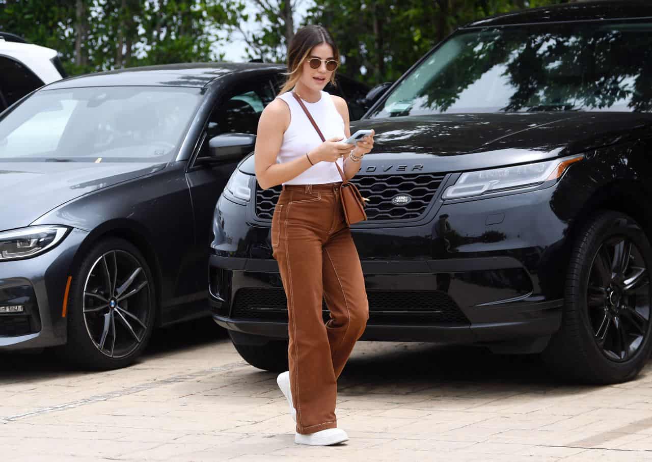 Lucy Hale Rocks a Casual White Top and Brown Jeans for Errands