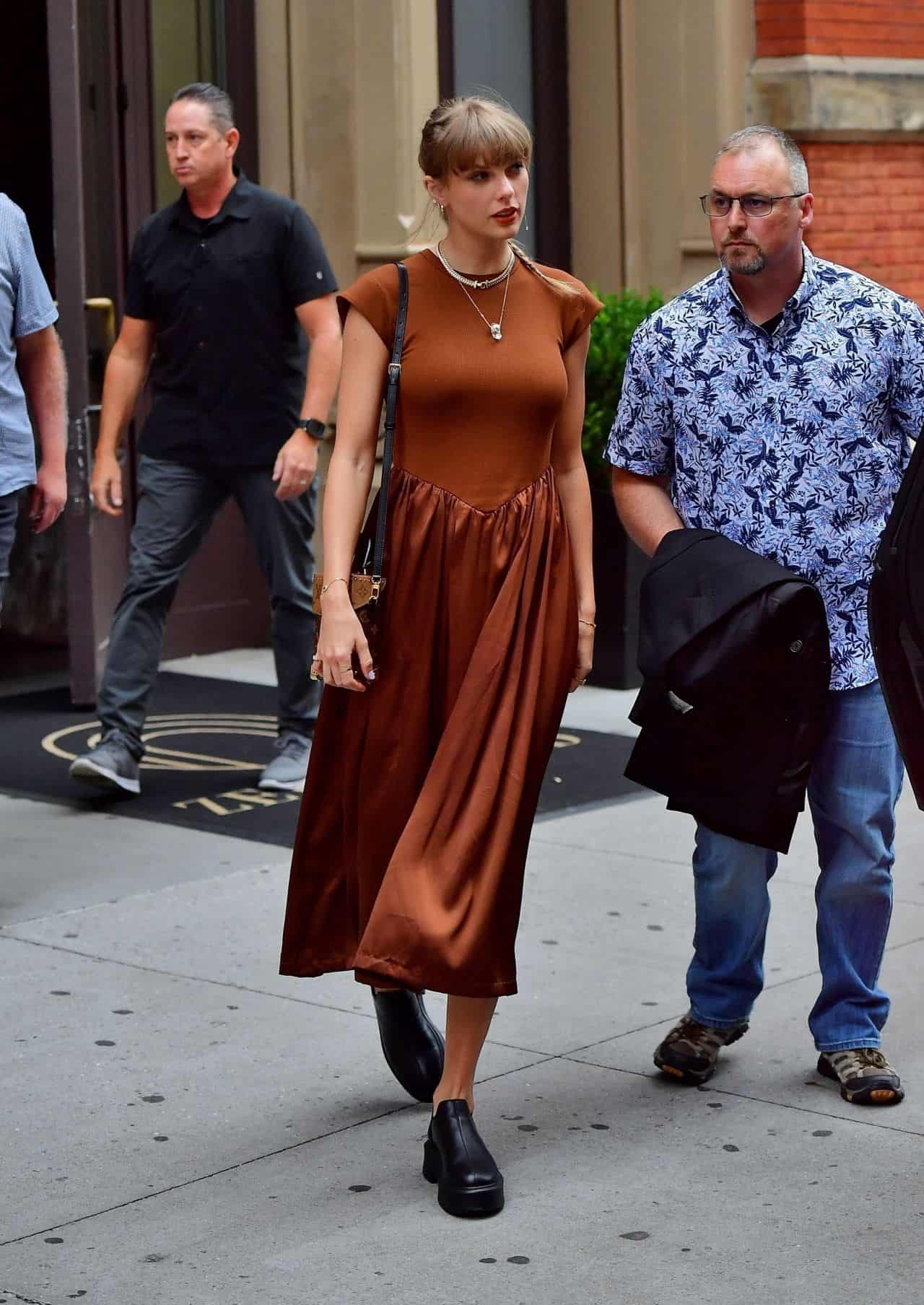 Taylor Swift Looks Effortlessly Stylish in Rust Satin Mini Dress