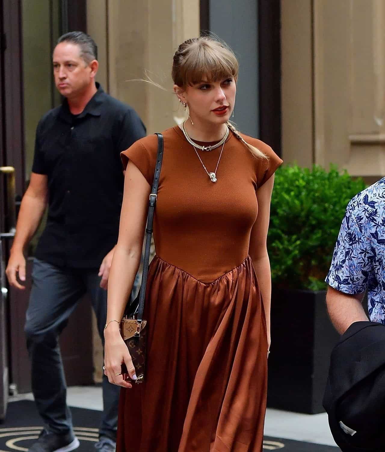 Taylor Swift Looks Effortlessly Stylish in Rust Satin Mini Dress