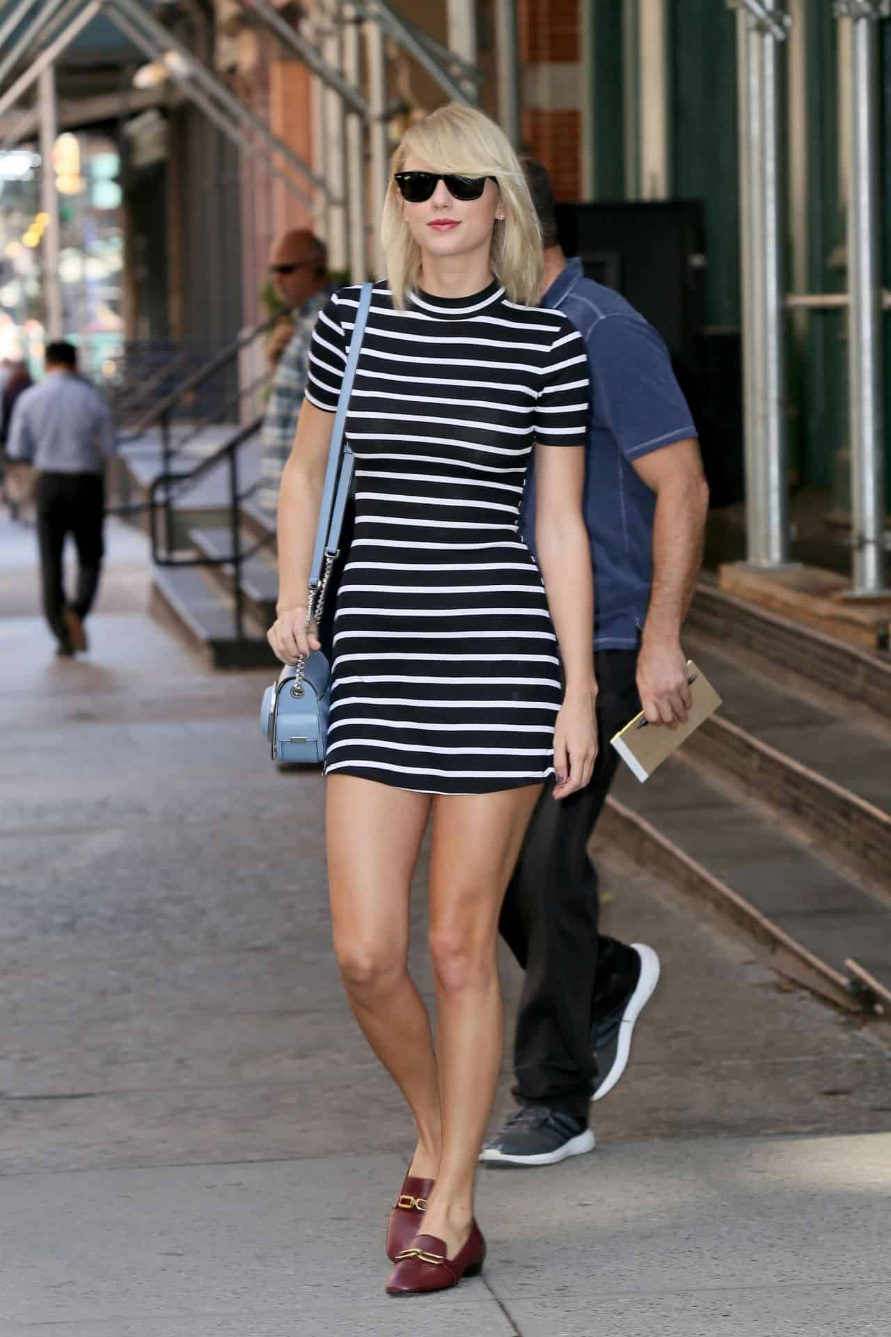 Taylor Swift Steps Out in NYC in Sleek Black and White Striped Dress