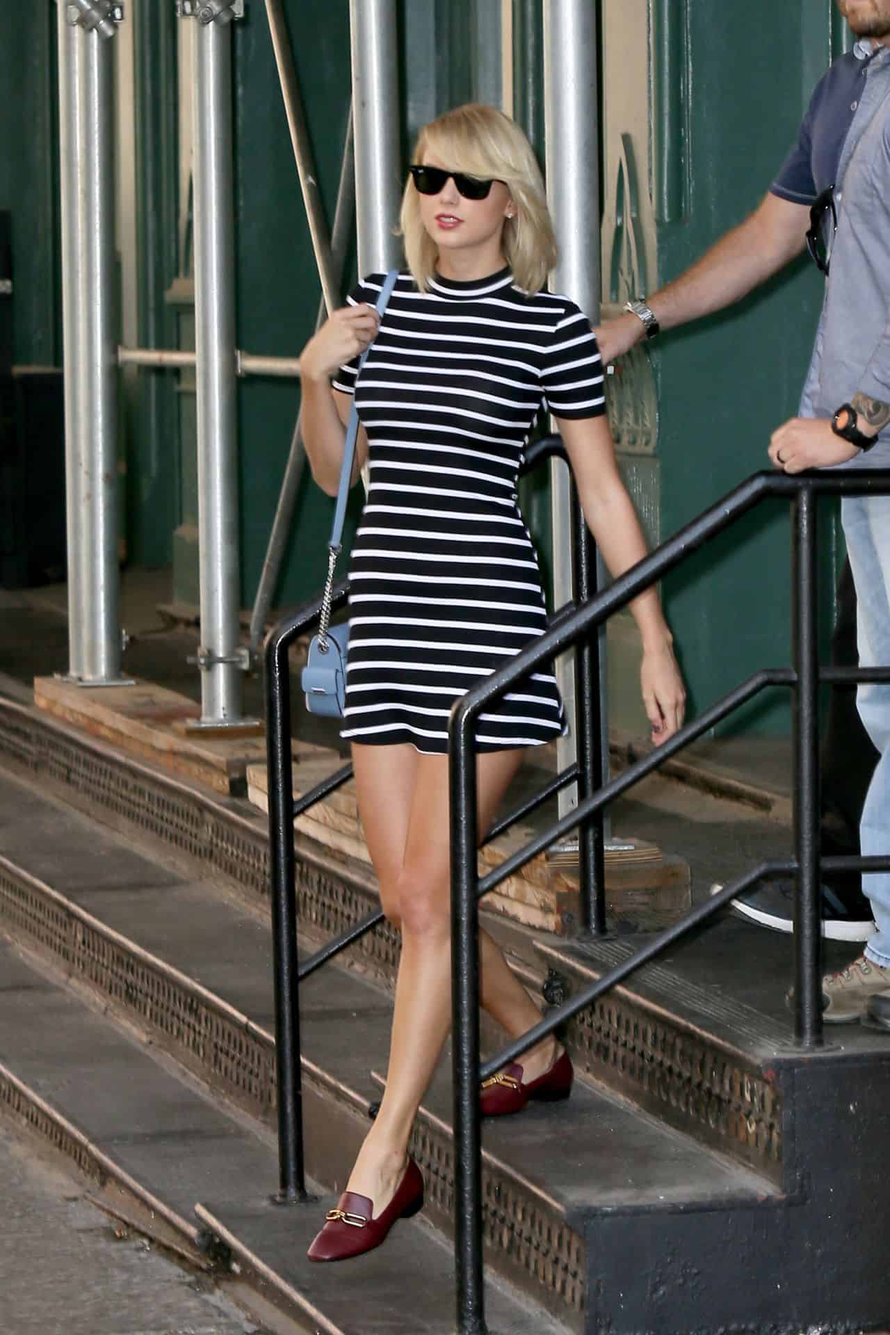 Taylor Swift Steps Out in NYC in Sleek Black and White Striped Dress