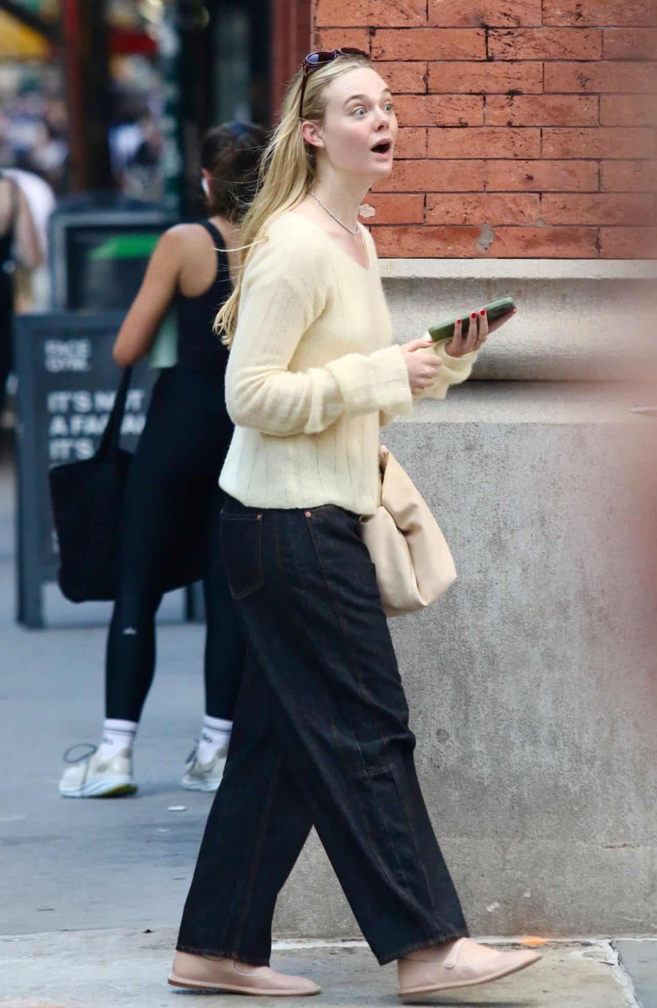 Elle Fanning Rocks Buttery Yellow Top and Black Pants in New York City
